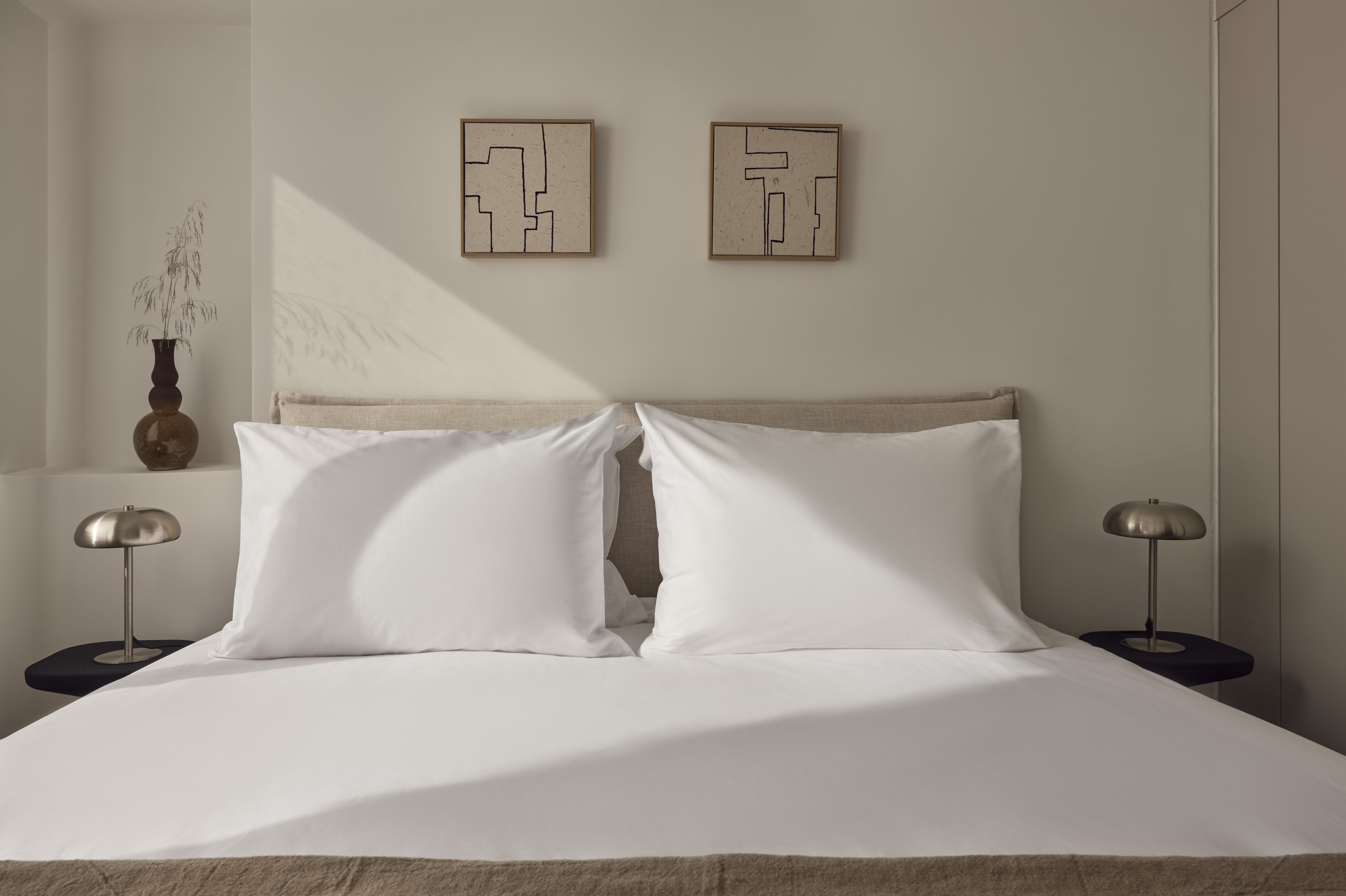 a bed with white sheets