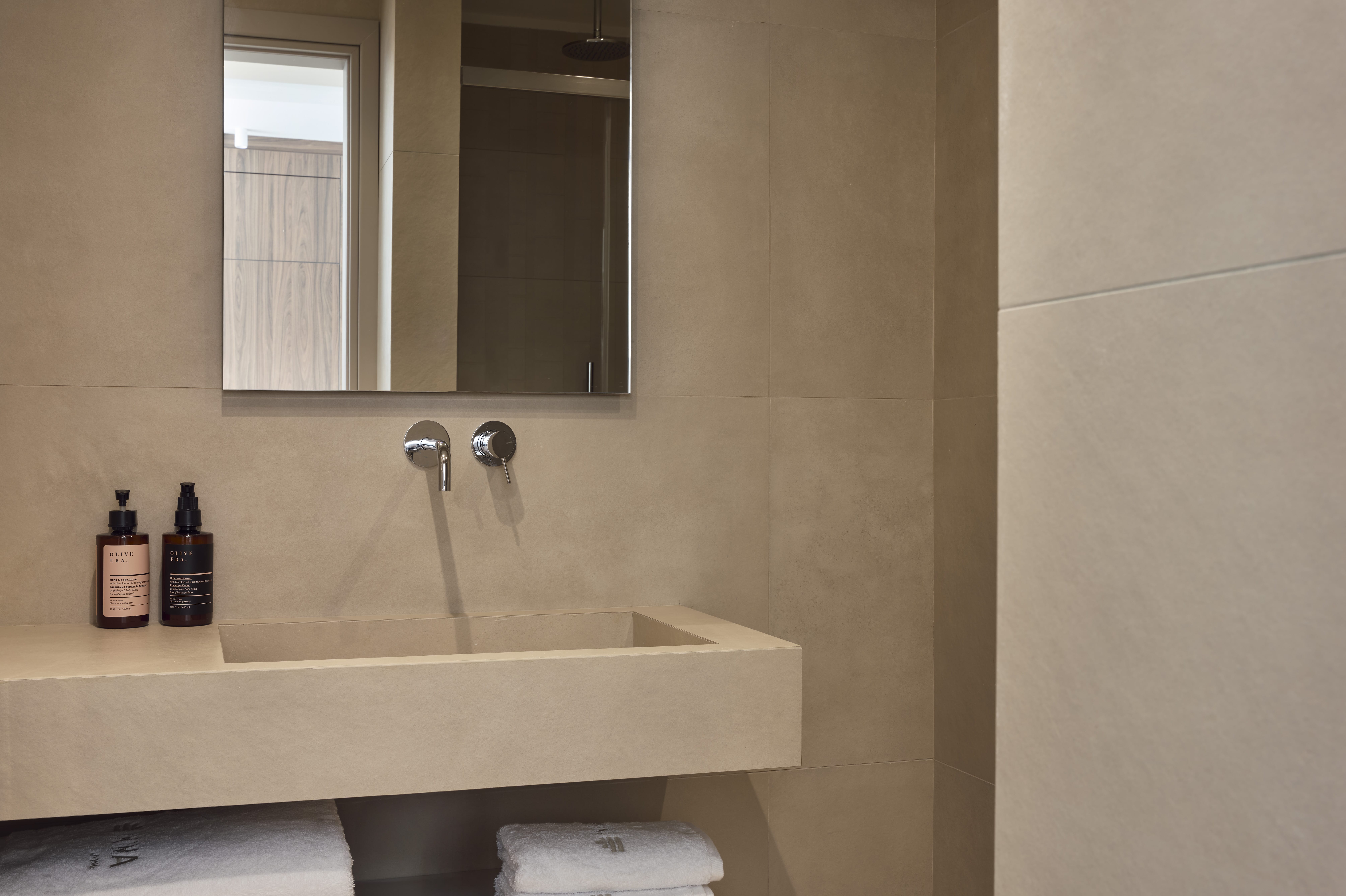 a bathroom with a sink and mirror