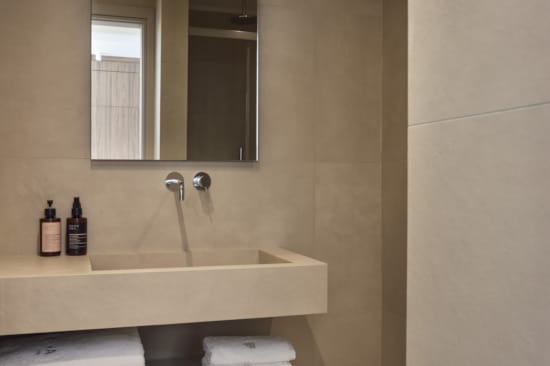 a bathroom with a sink and mirror