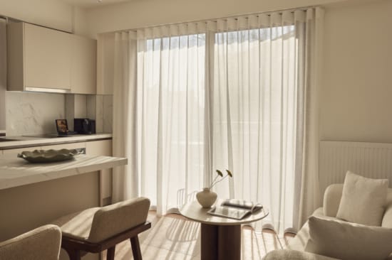 a room with a table and chairs