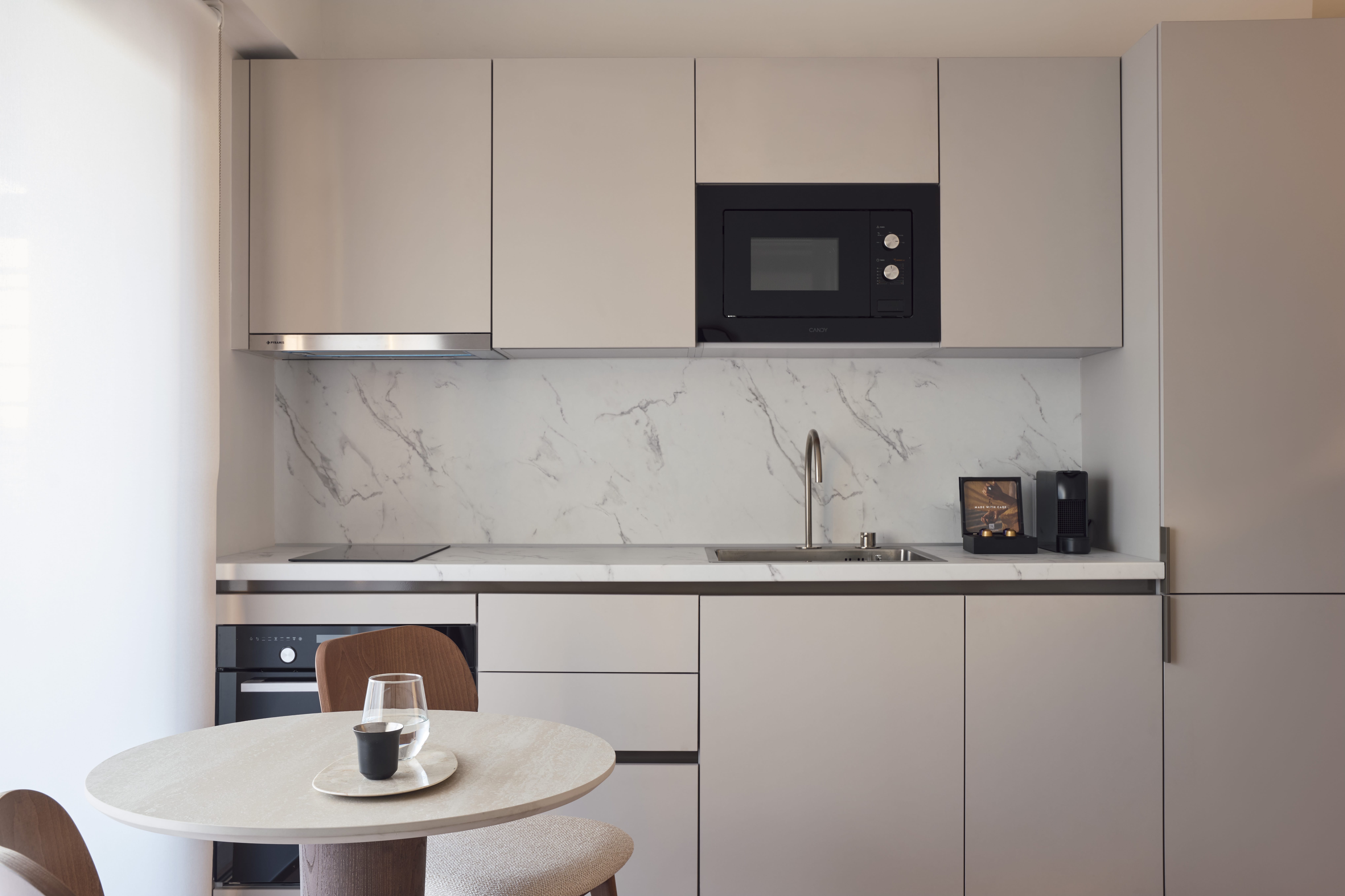 a kitchen with white cabinets