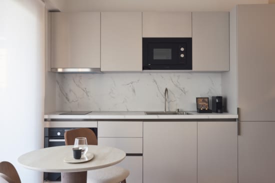 a kitchen with white cabinets