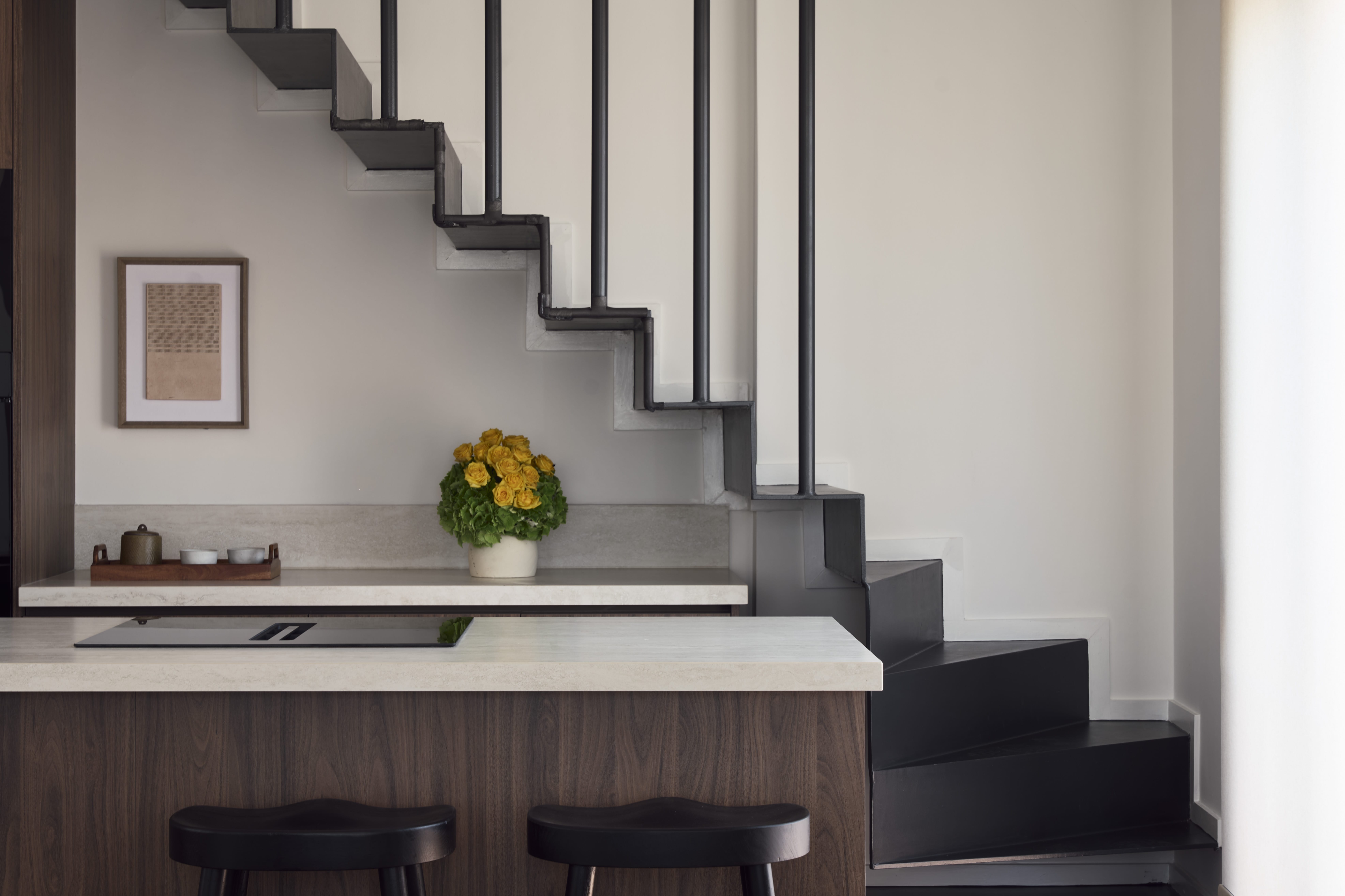 a kitchen with a staircase