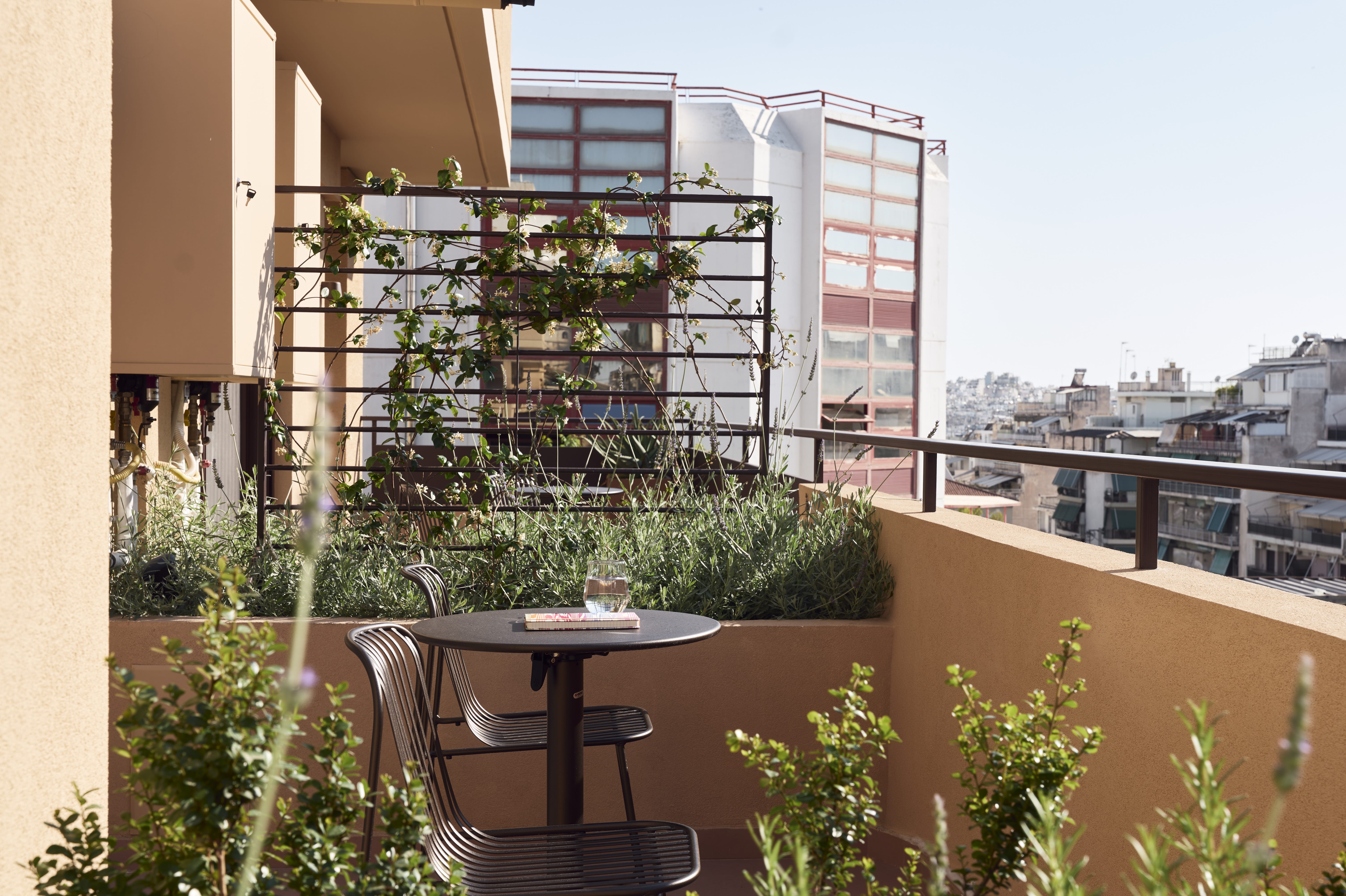 a table and chairs on a balcony