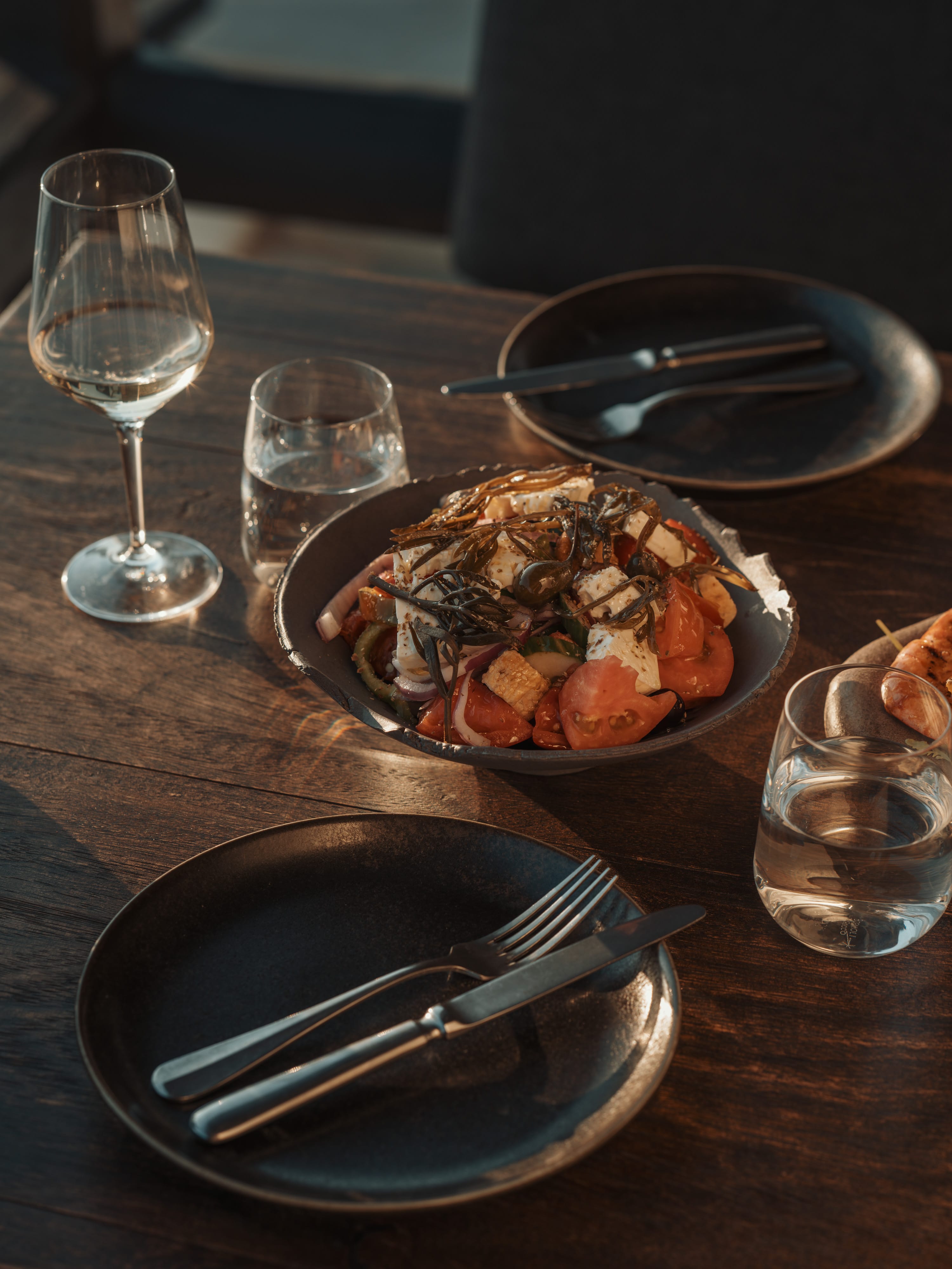 a plate of food and glasses on a table