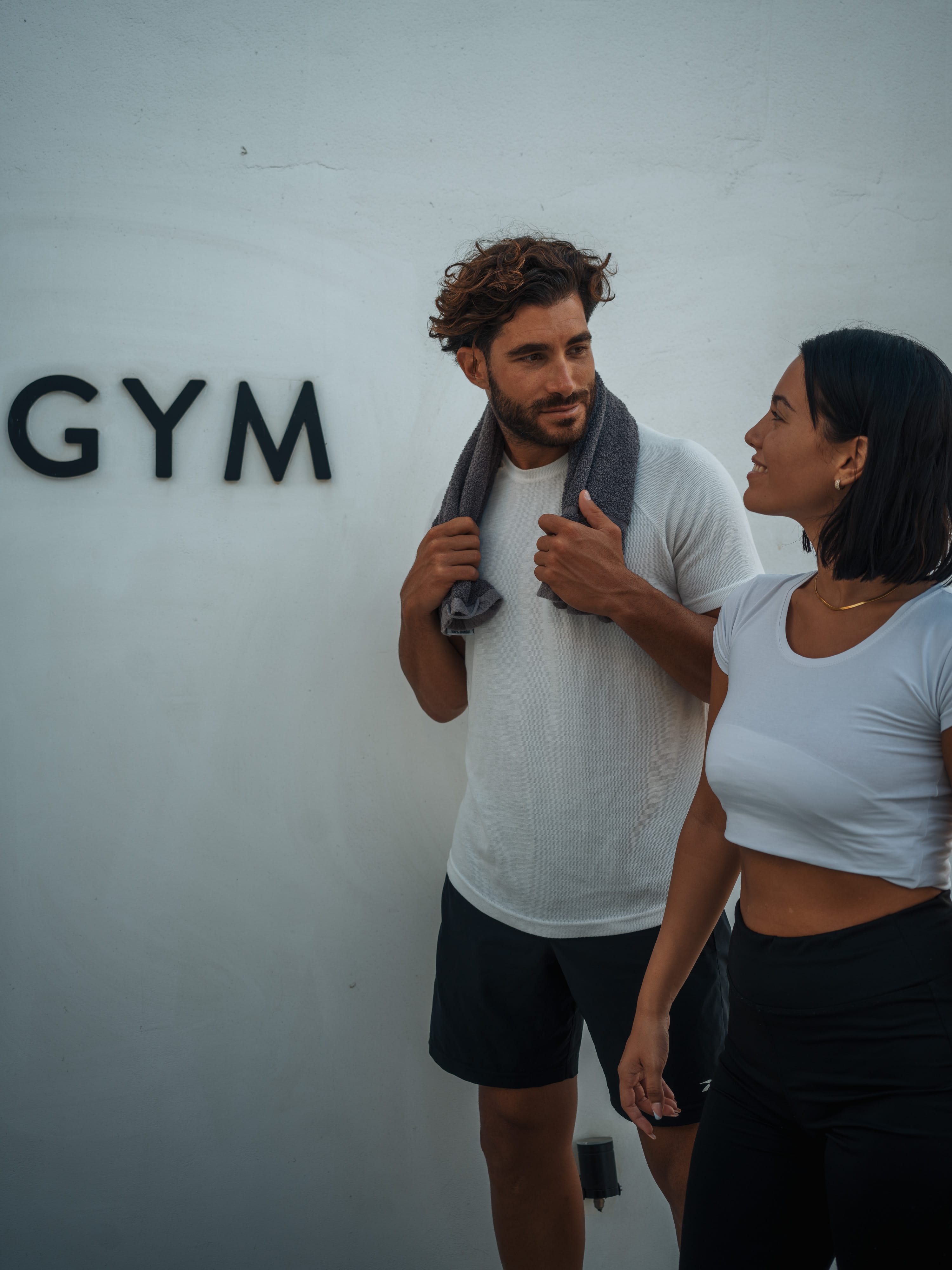 a man holding a microphone and a woman standing next to him