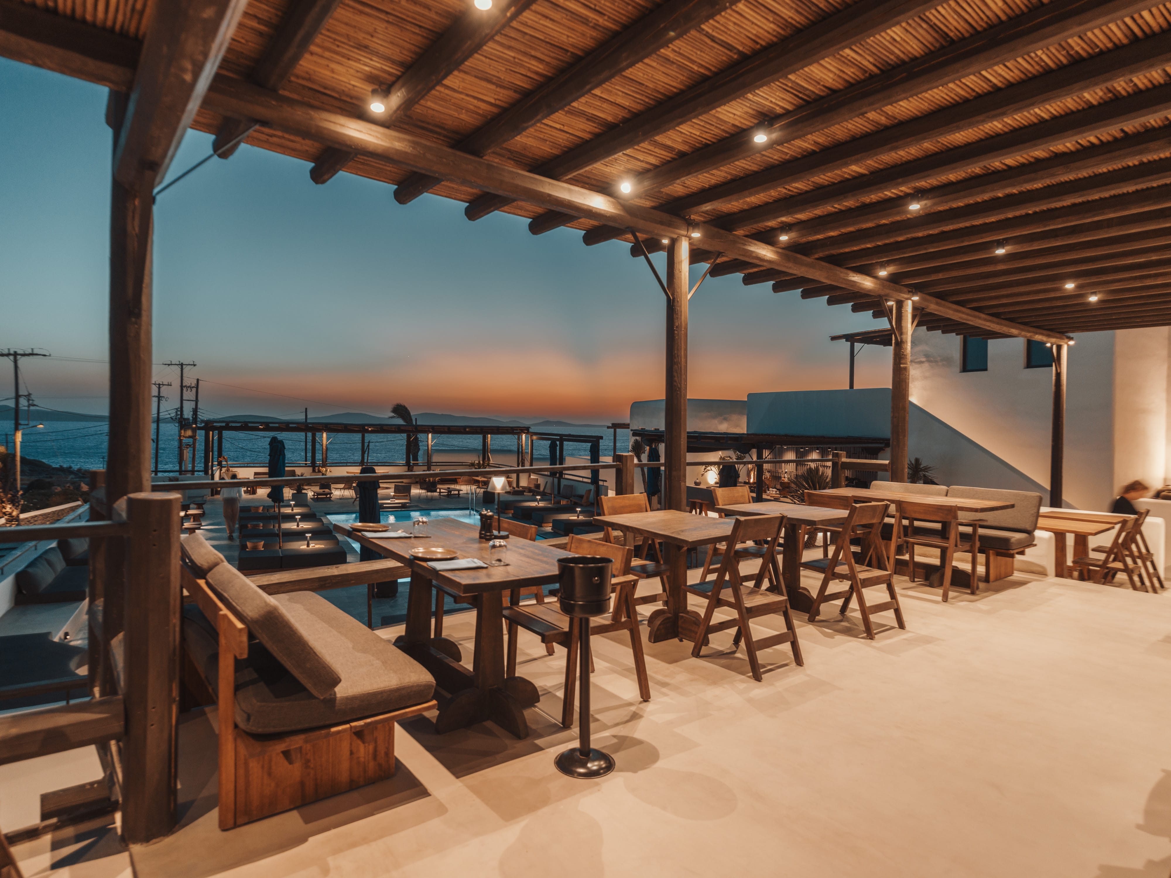 tables and chairs on a beach