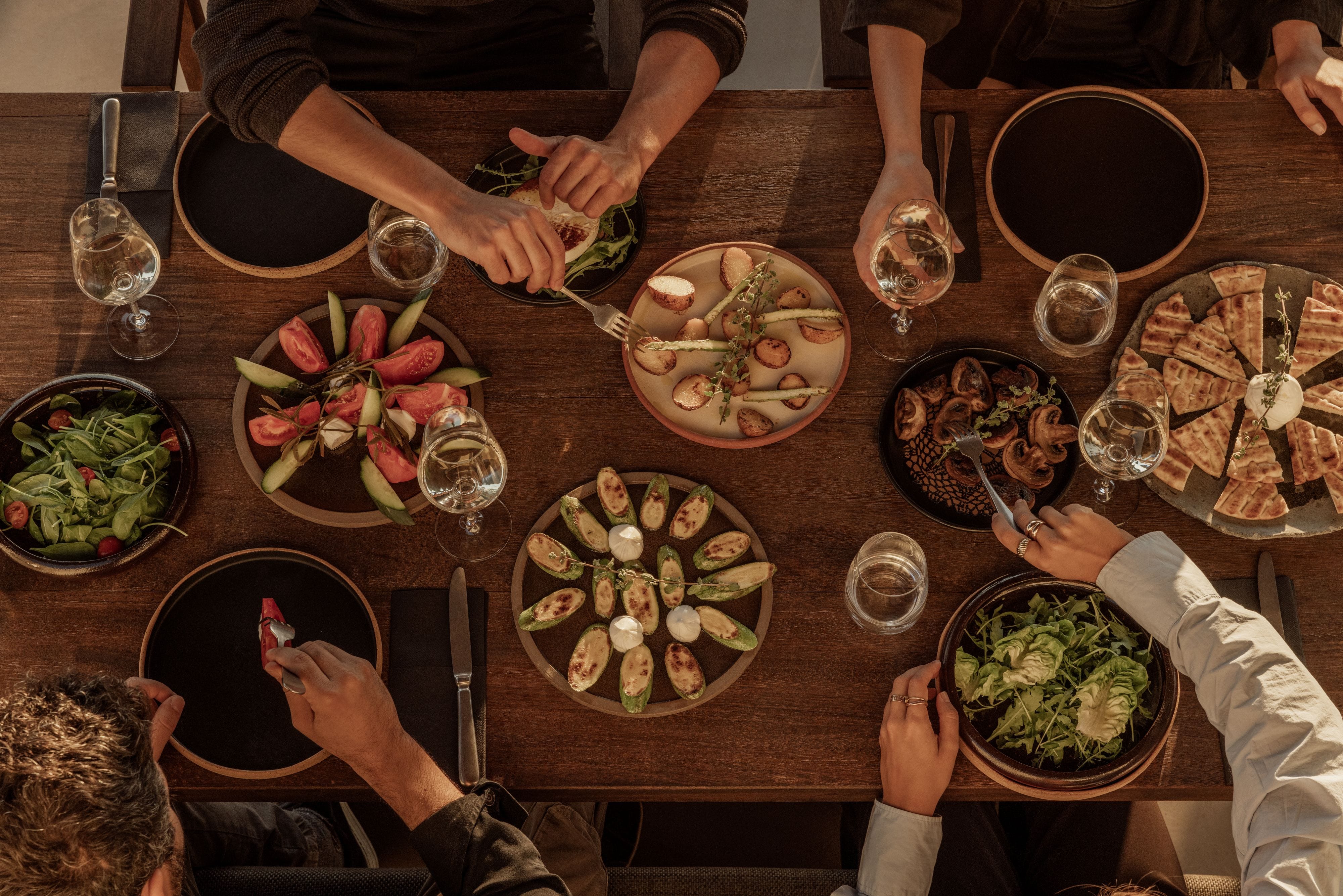 people eating pizza at a table