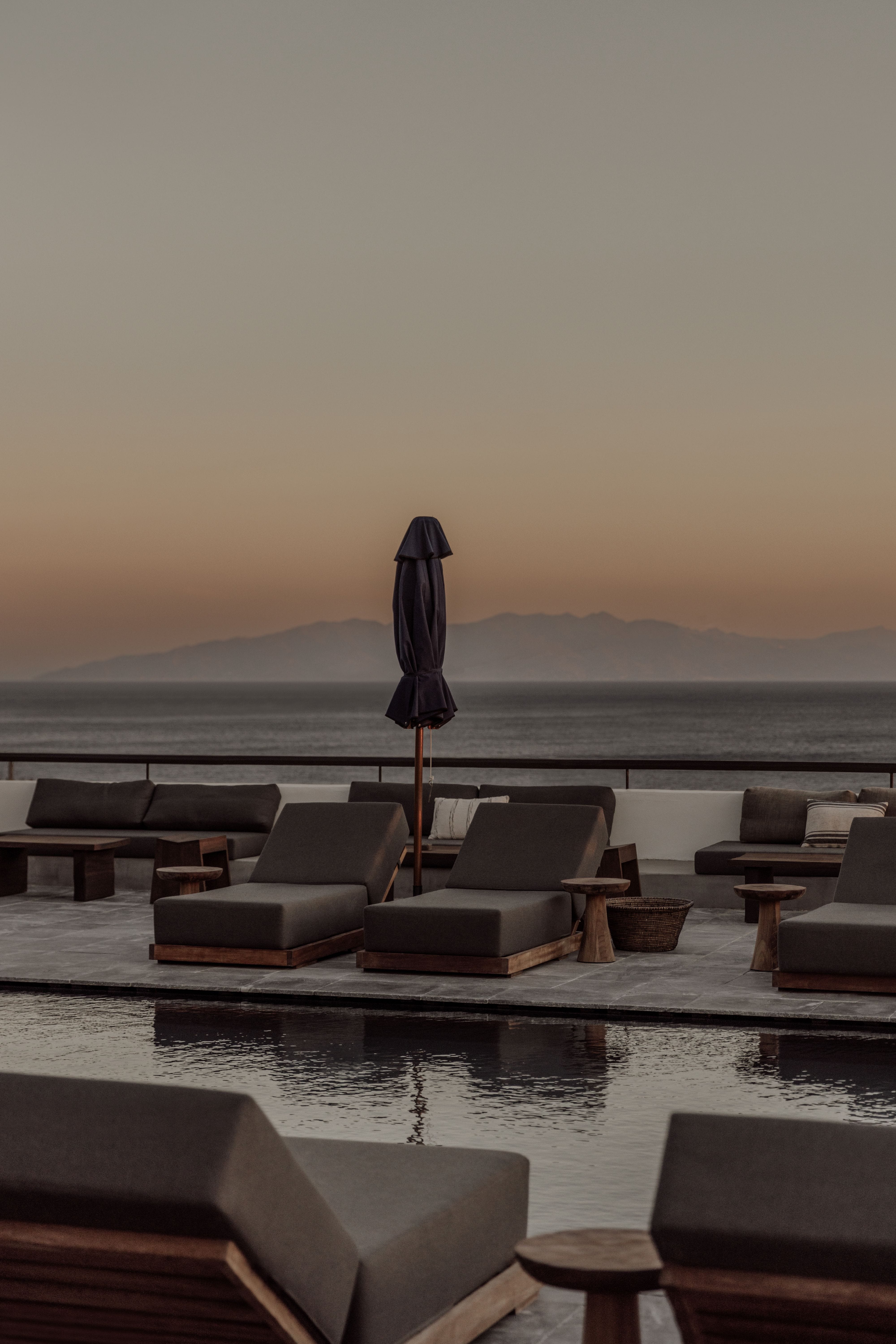 a group of chairs and a table on a dock