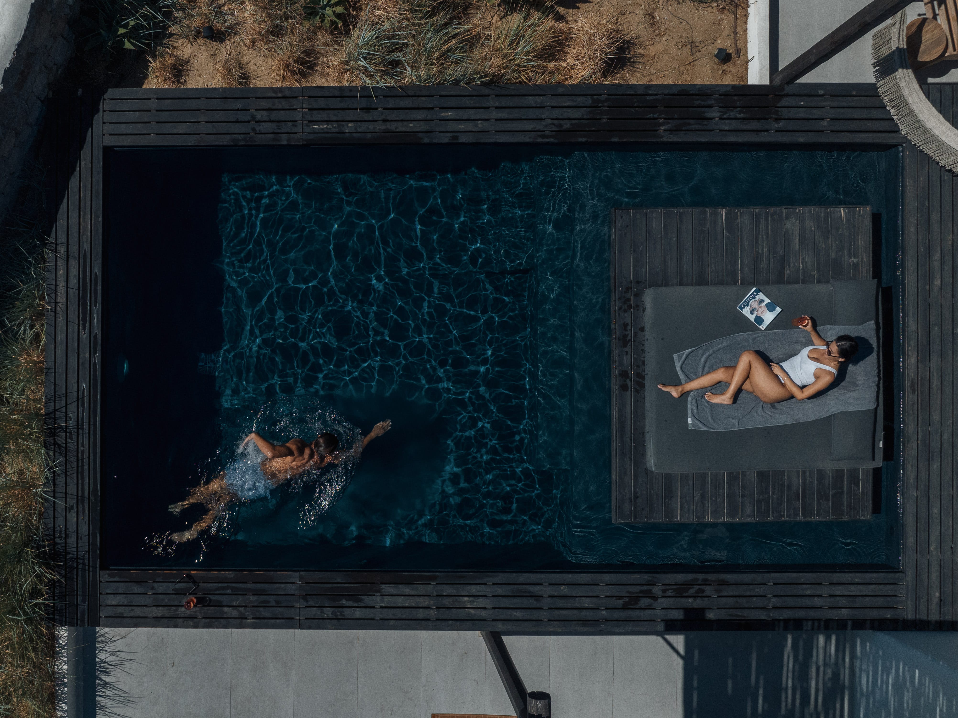 a group of people swimming in a pool