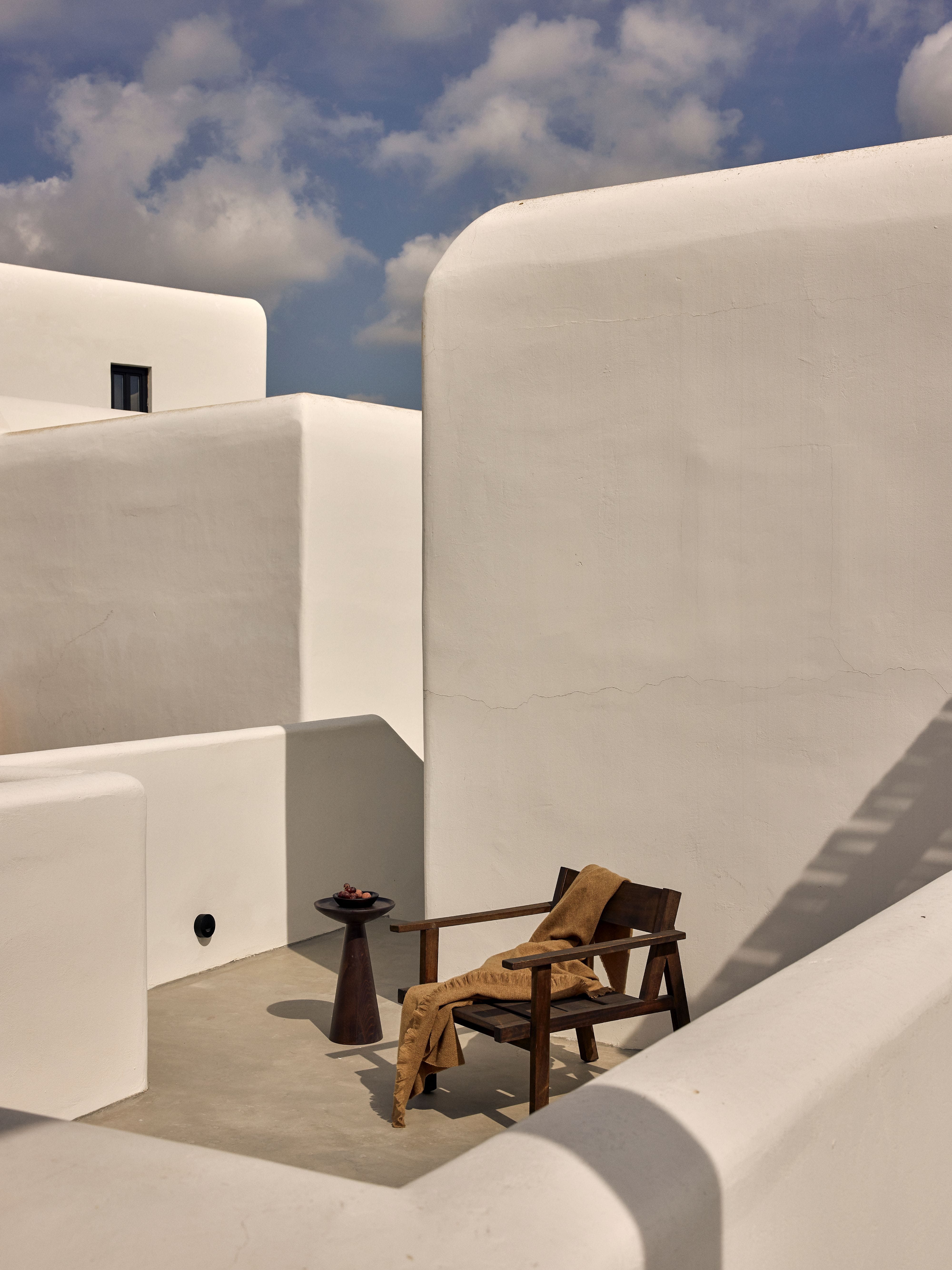 a chair and a table in a white building