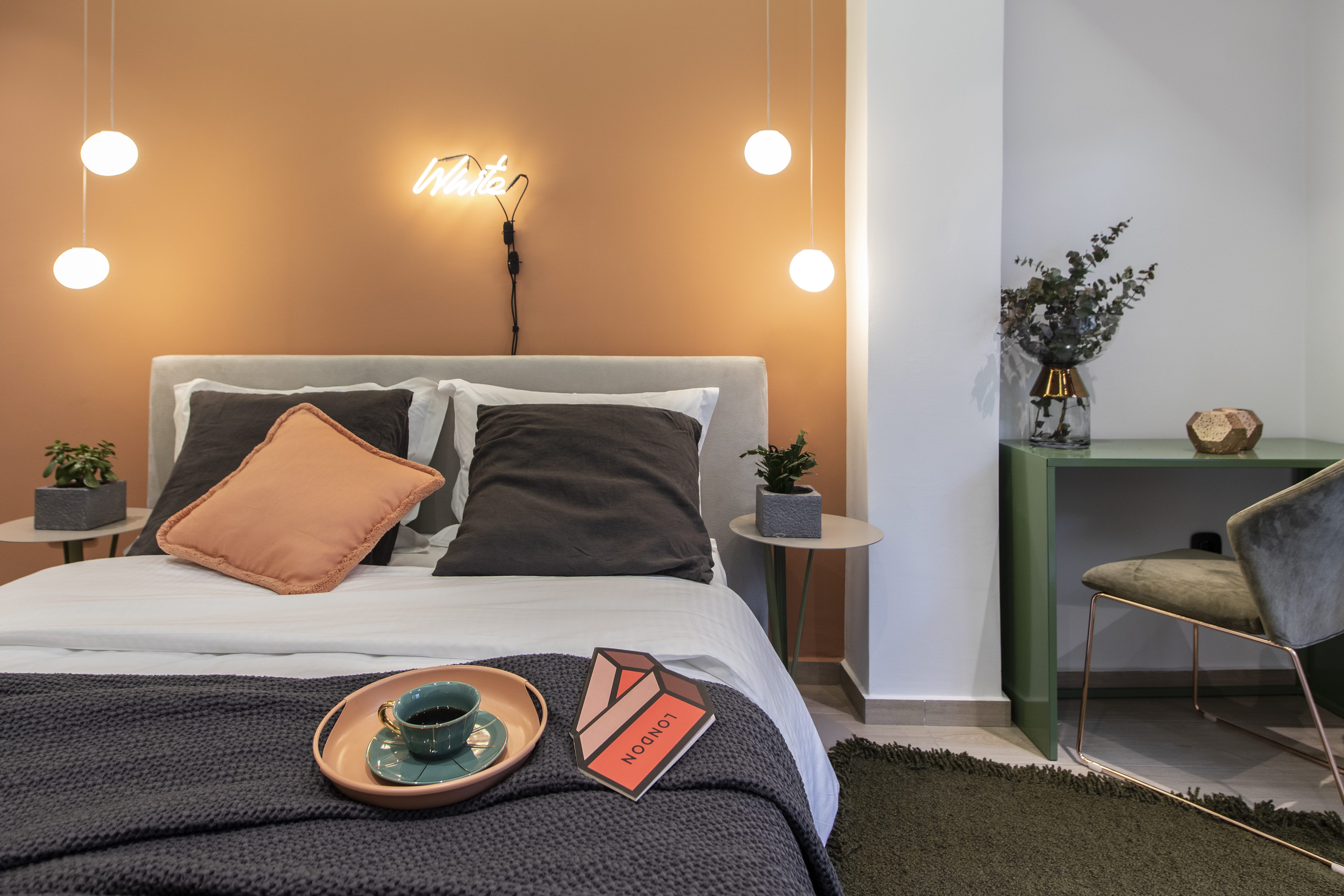 a bed with a table and chairs