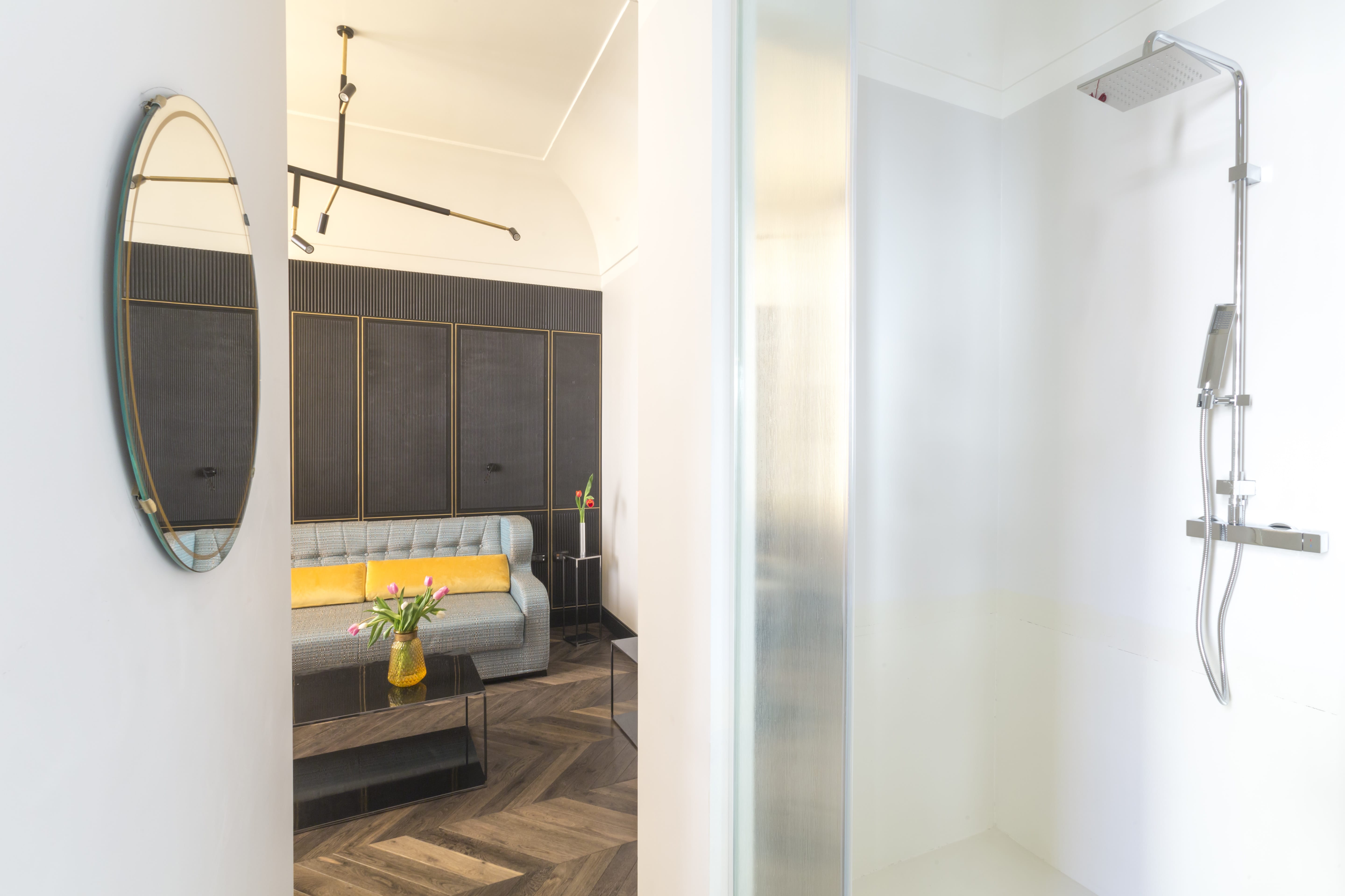 a room with a bed and a mirror