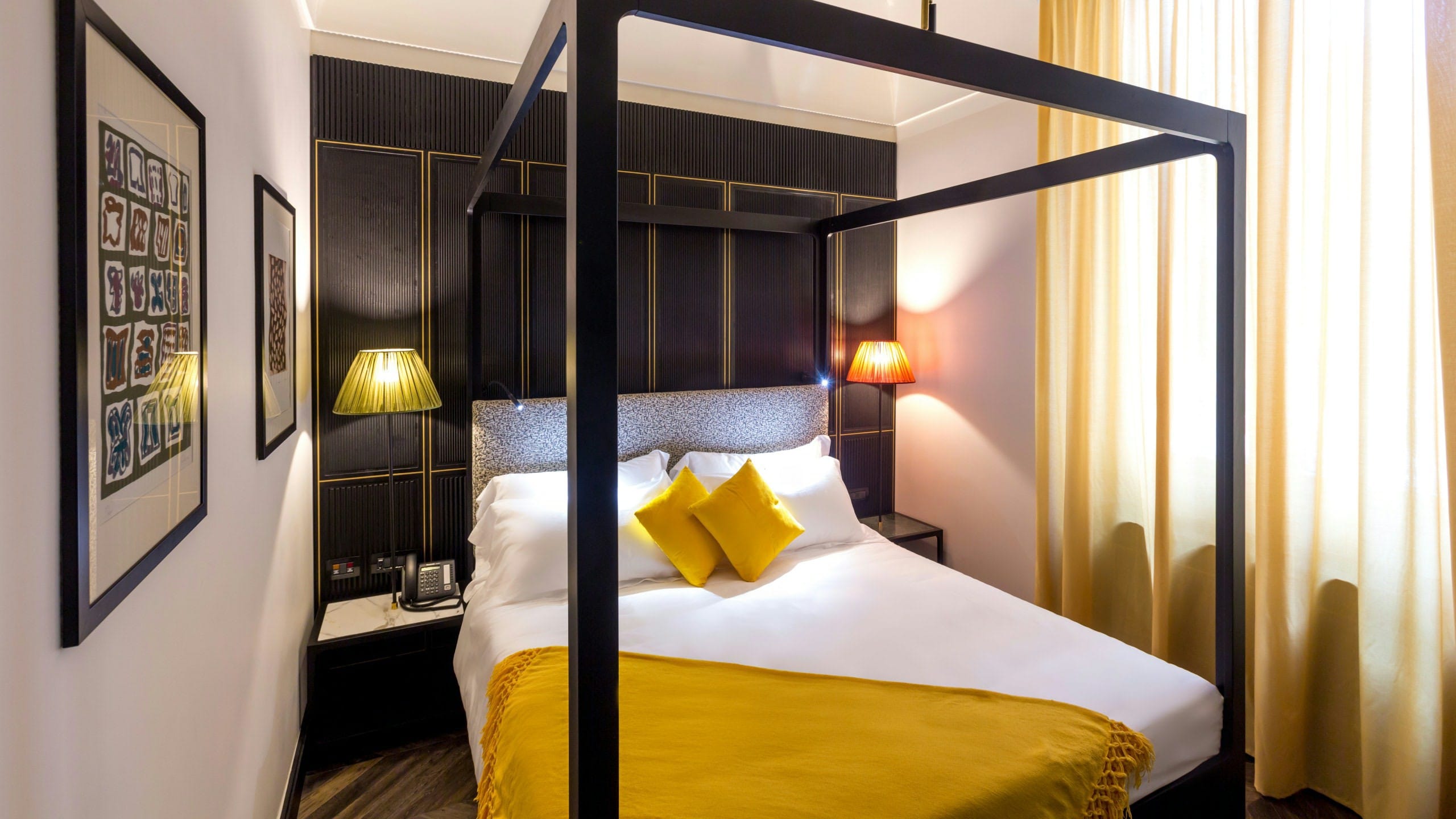 a bed with yellow pillows