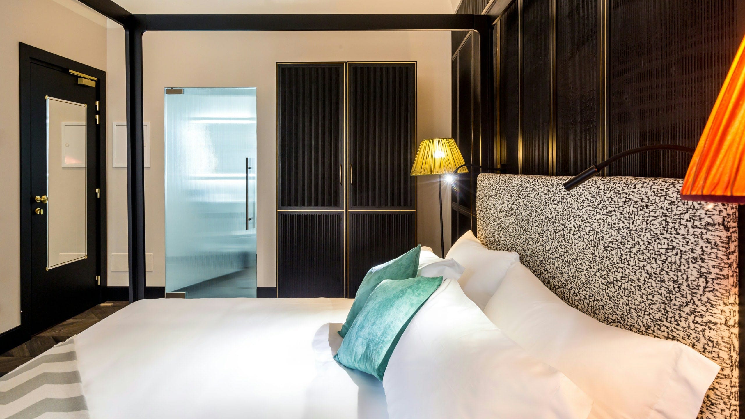 a bed with a white comforter