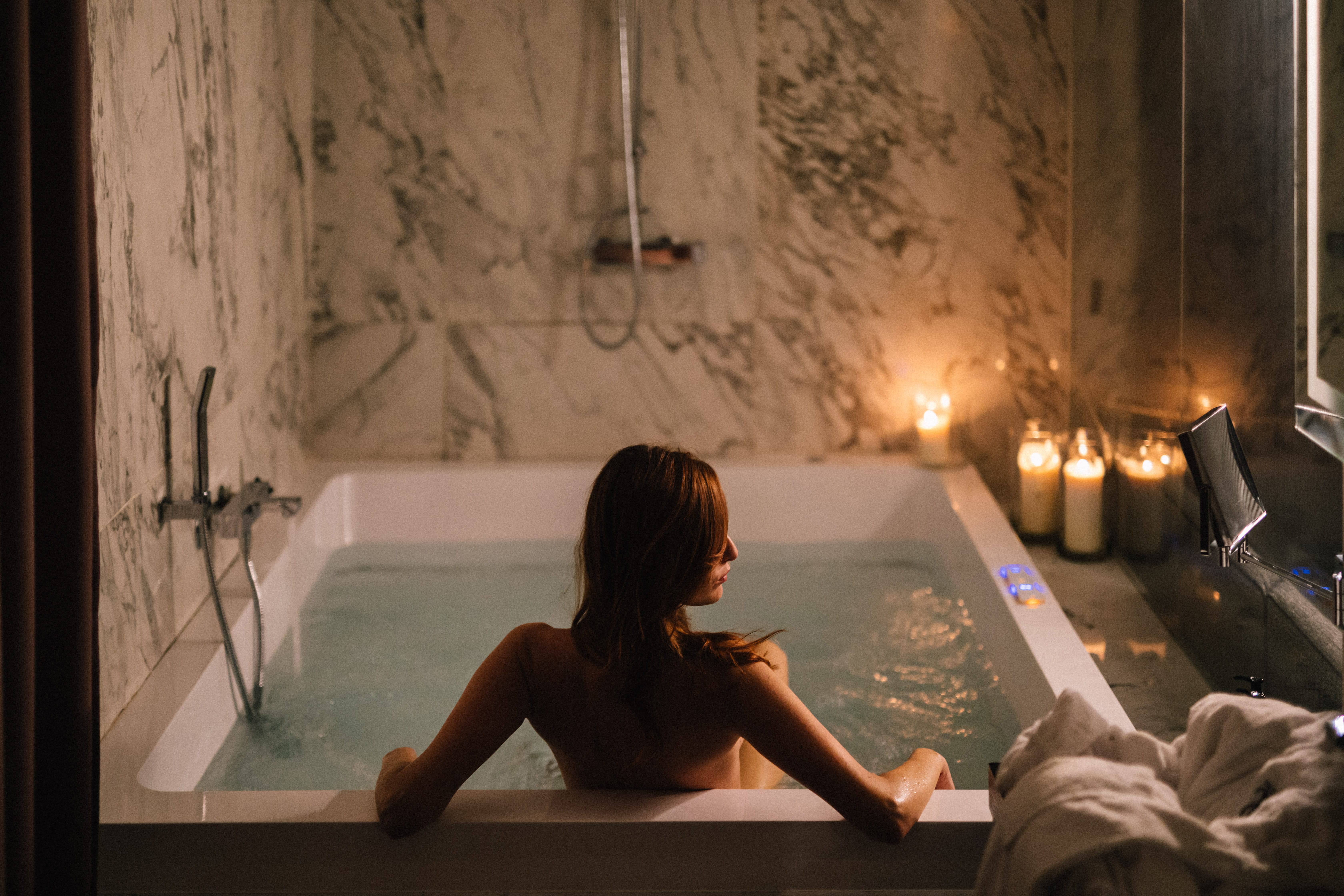 a person sitting in a bathtub