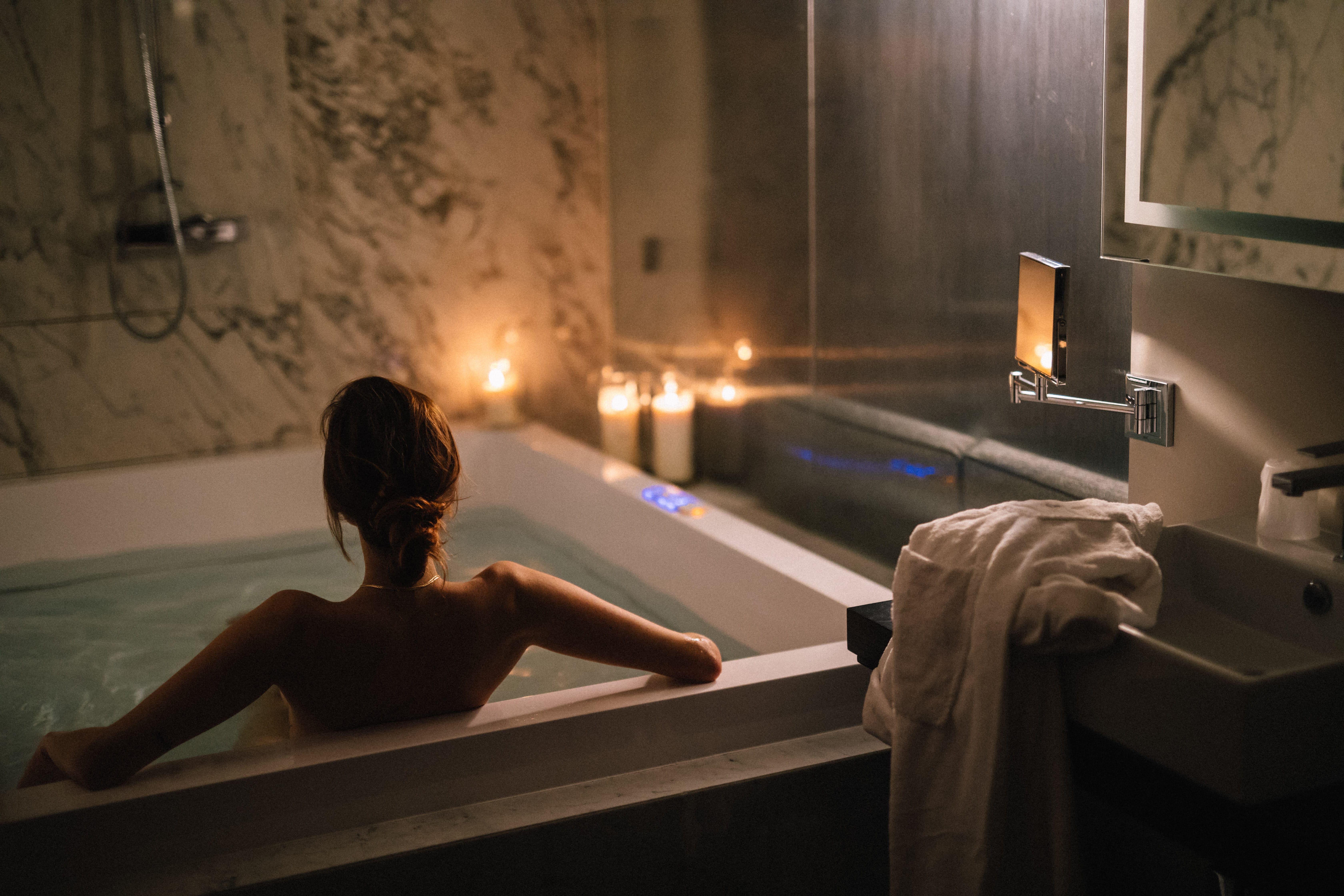 a person sitting in a bathtub