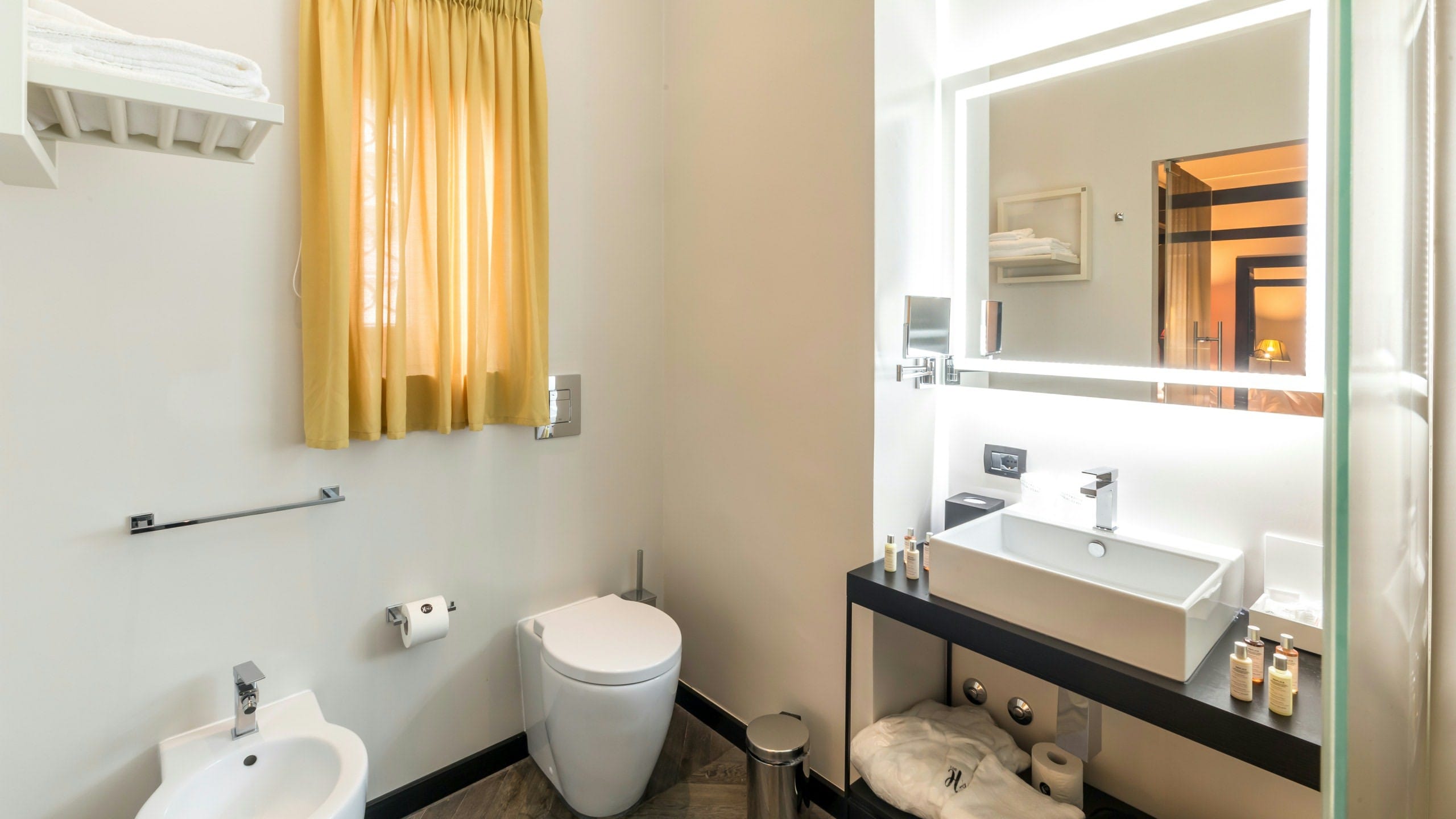 a bathroom with a mirror and sink