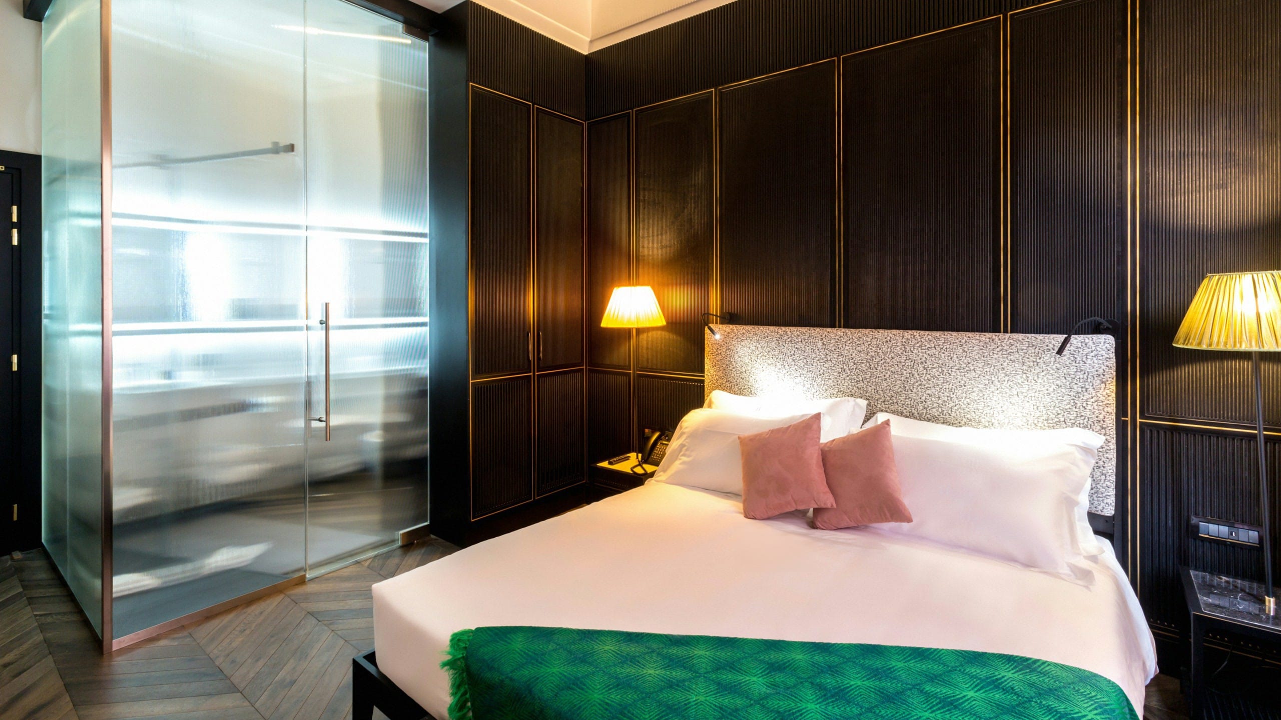 a bed with a glass door