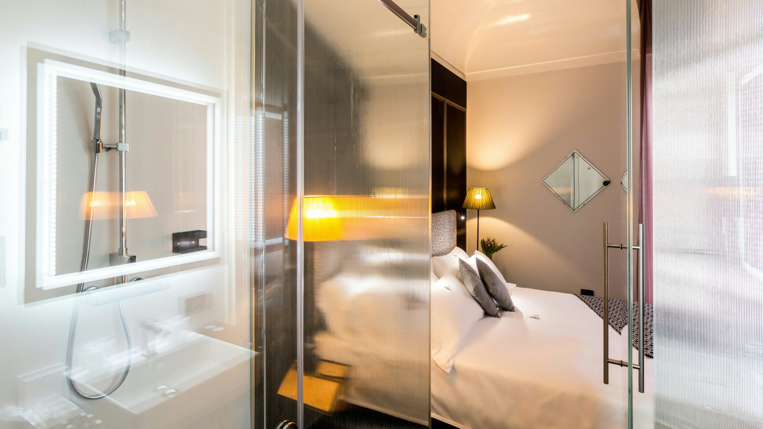 a room with a bed and a mirror