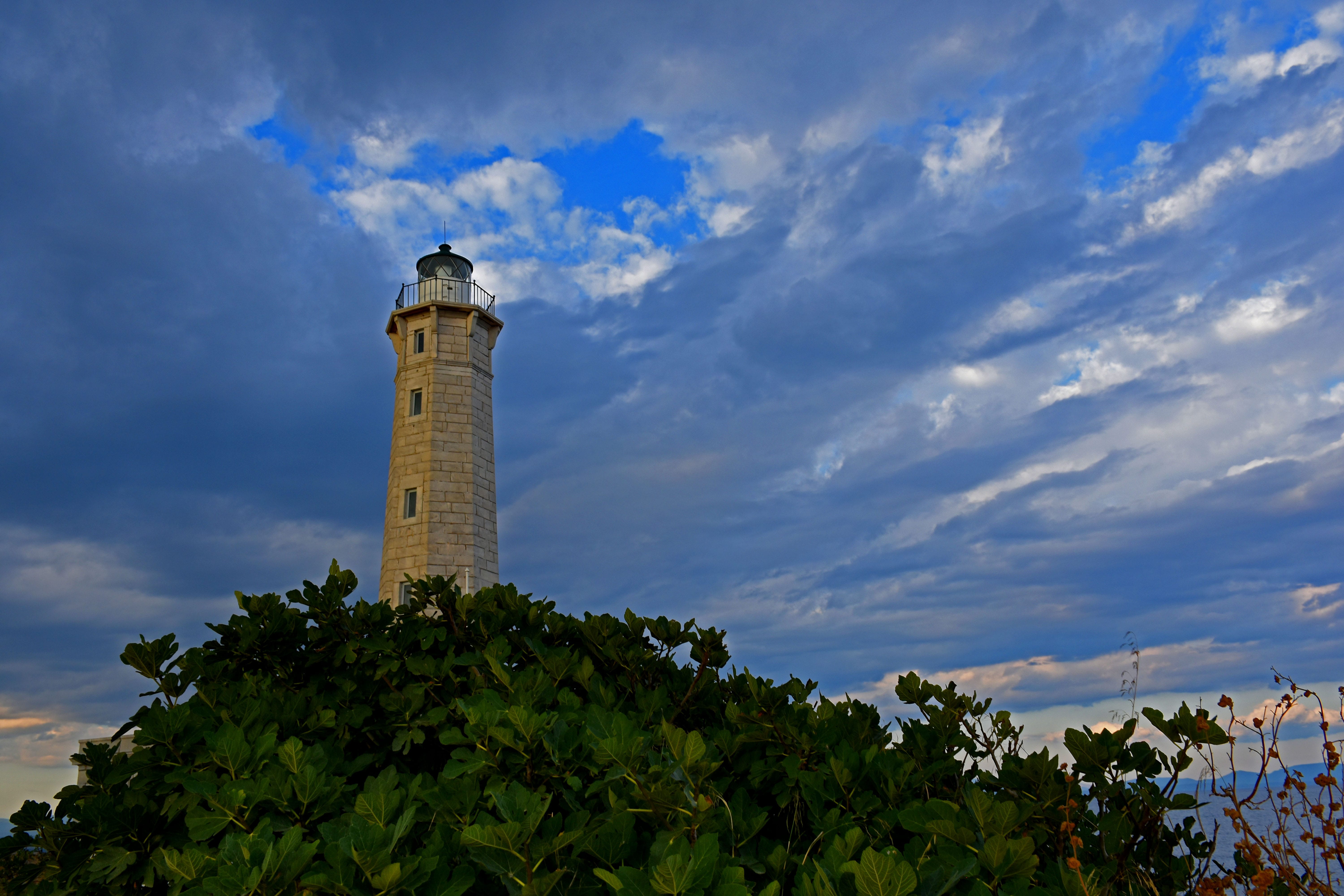 a tall tower with a light house