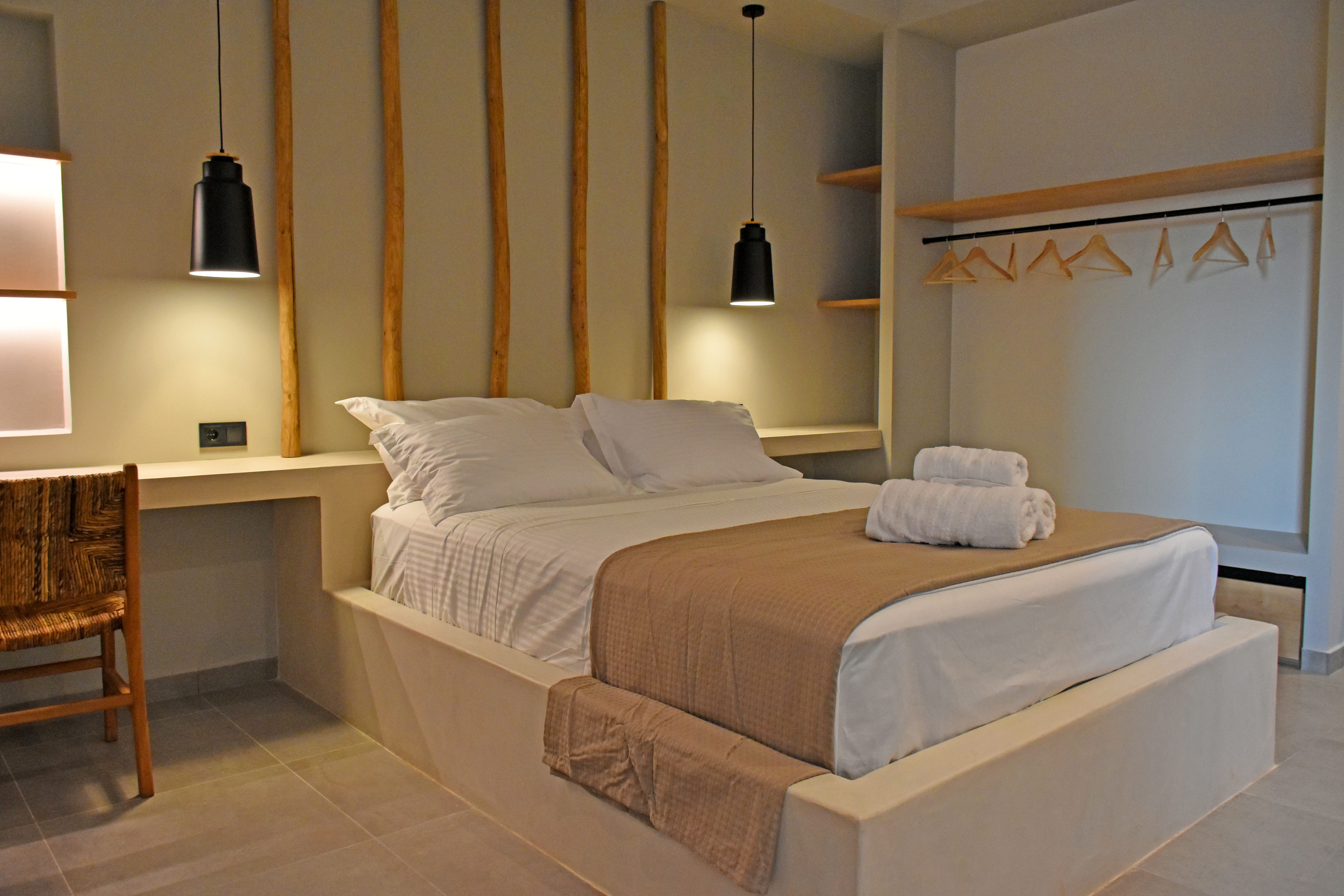 a couple of beds sit in a room