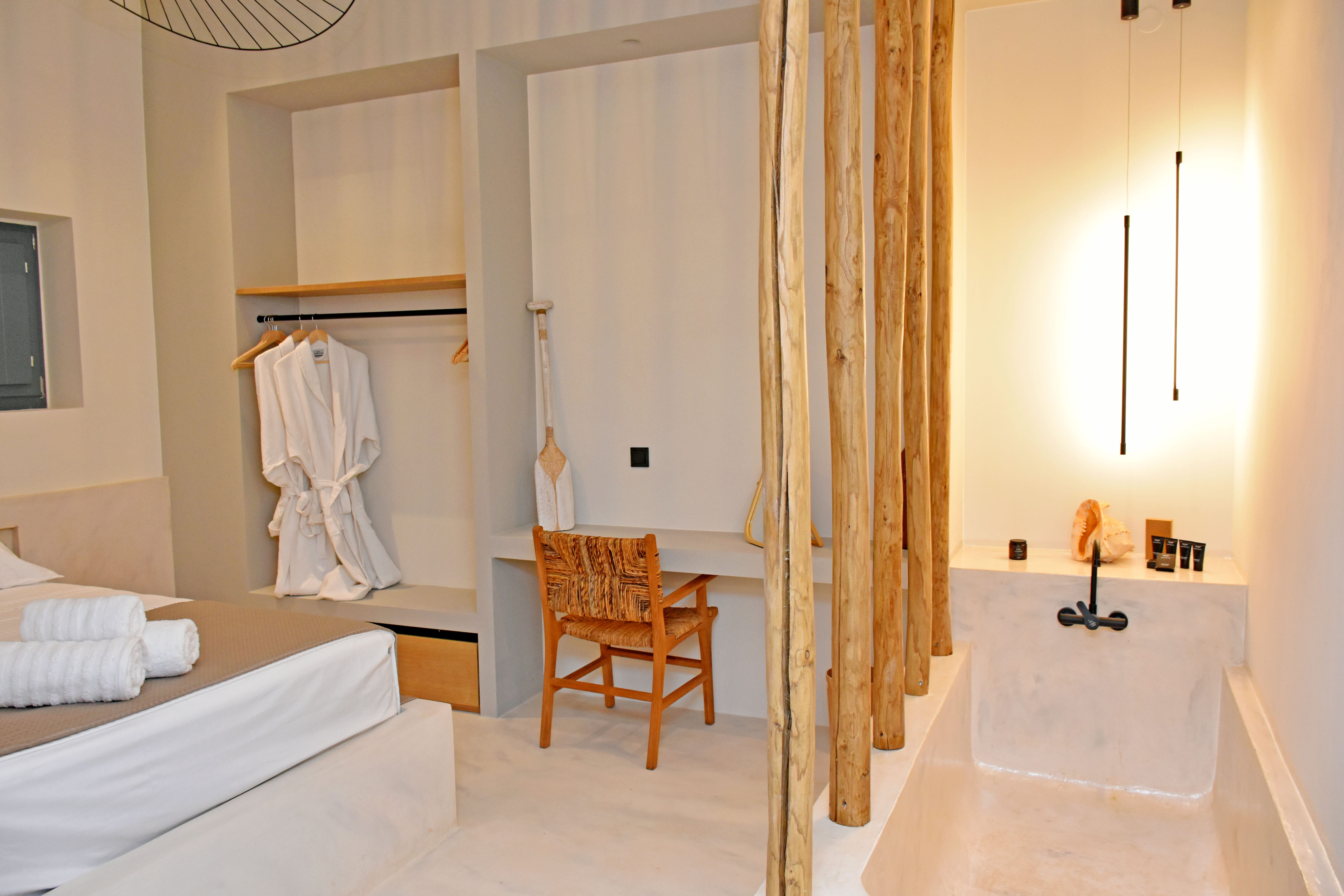 a bathroom with a tub and a toilet