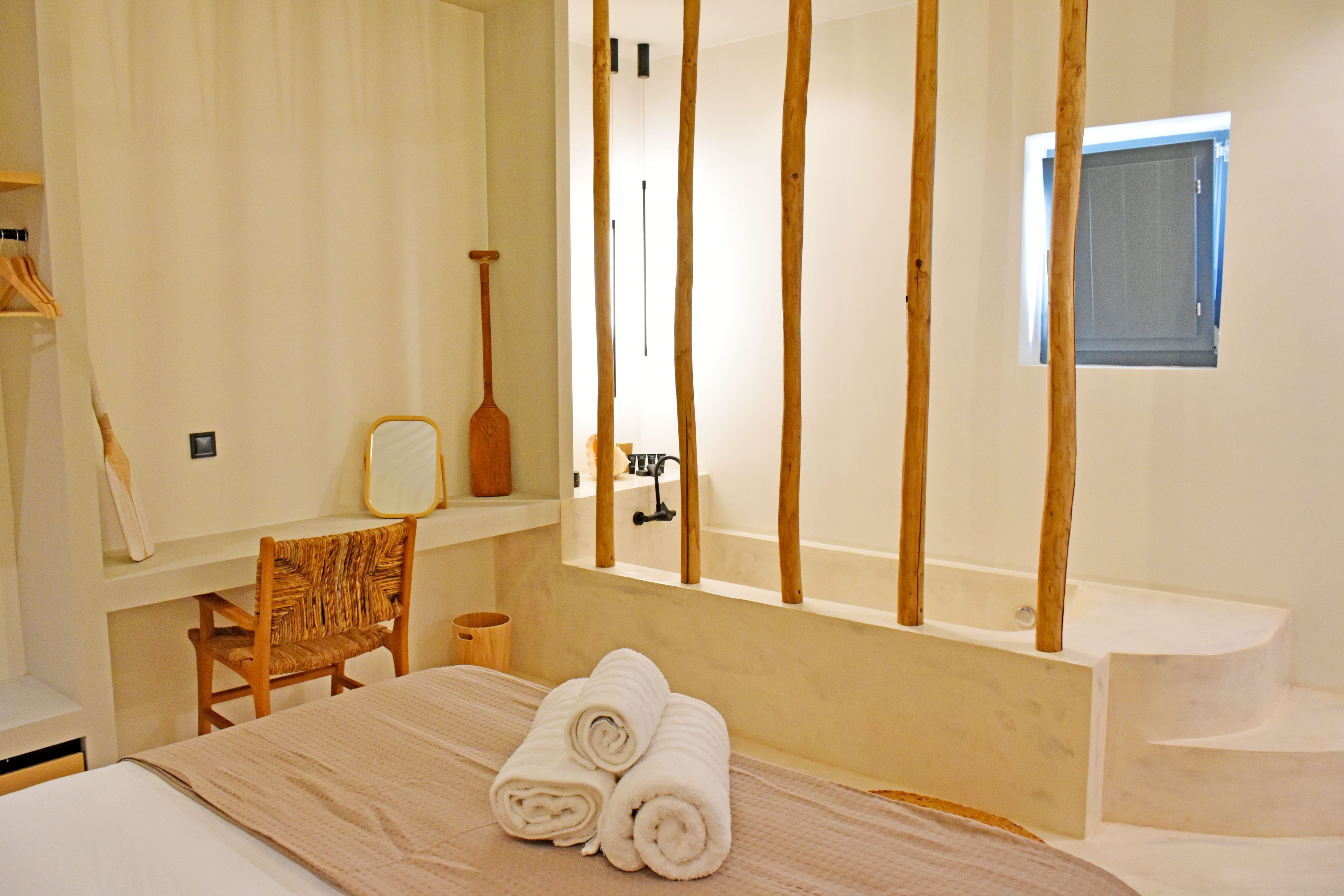 a bed with a white towel on it