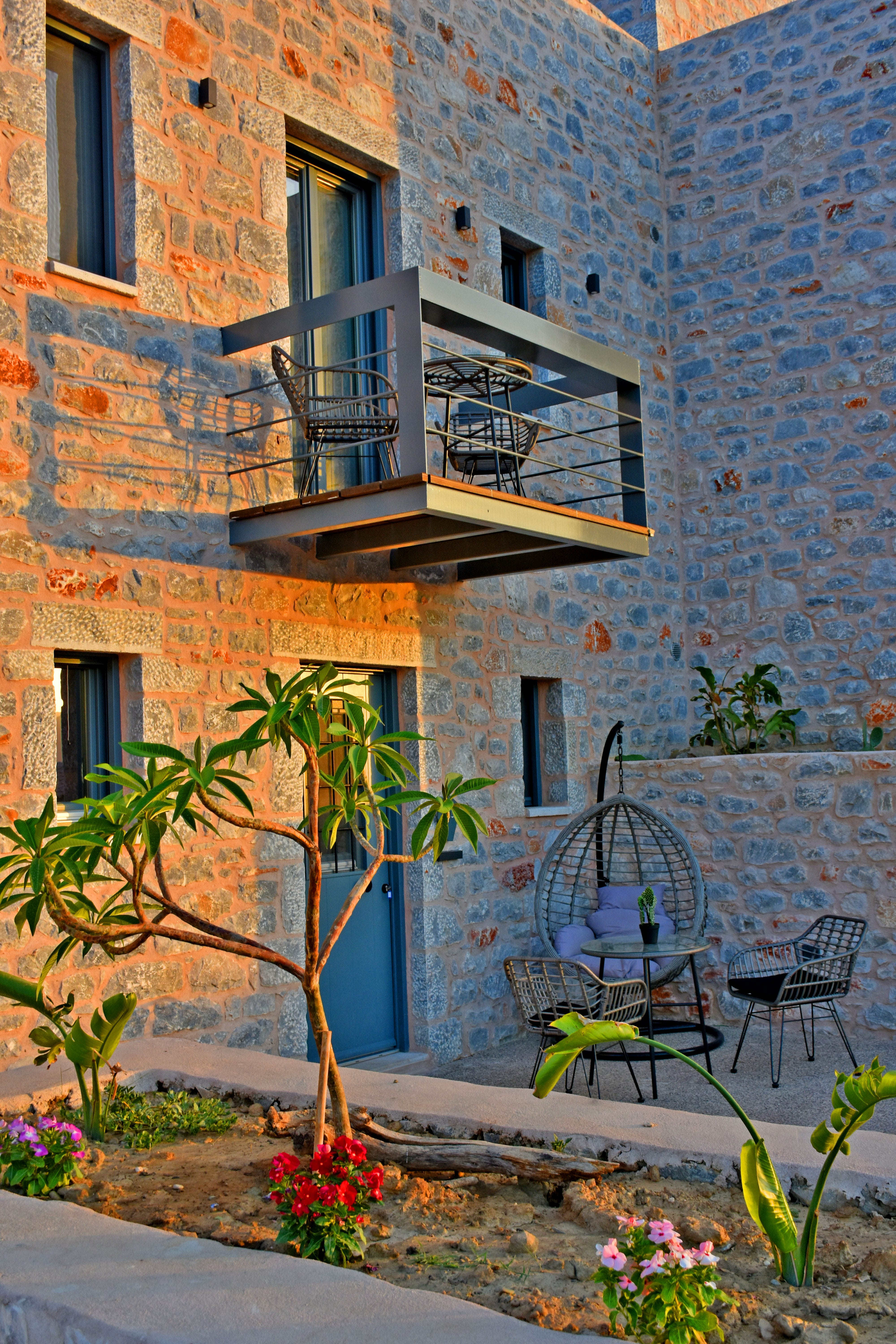 a balcony with a table and chairs