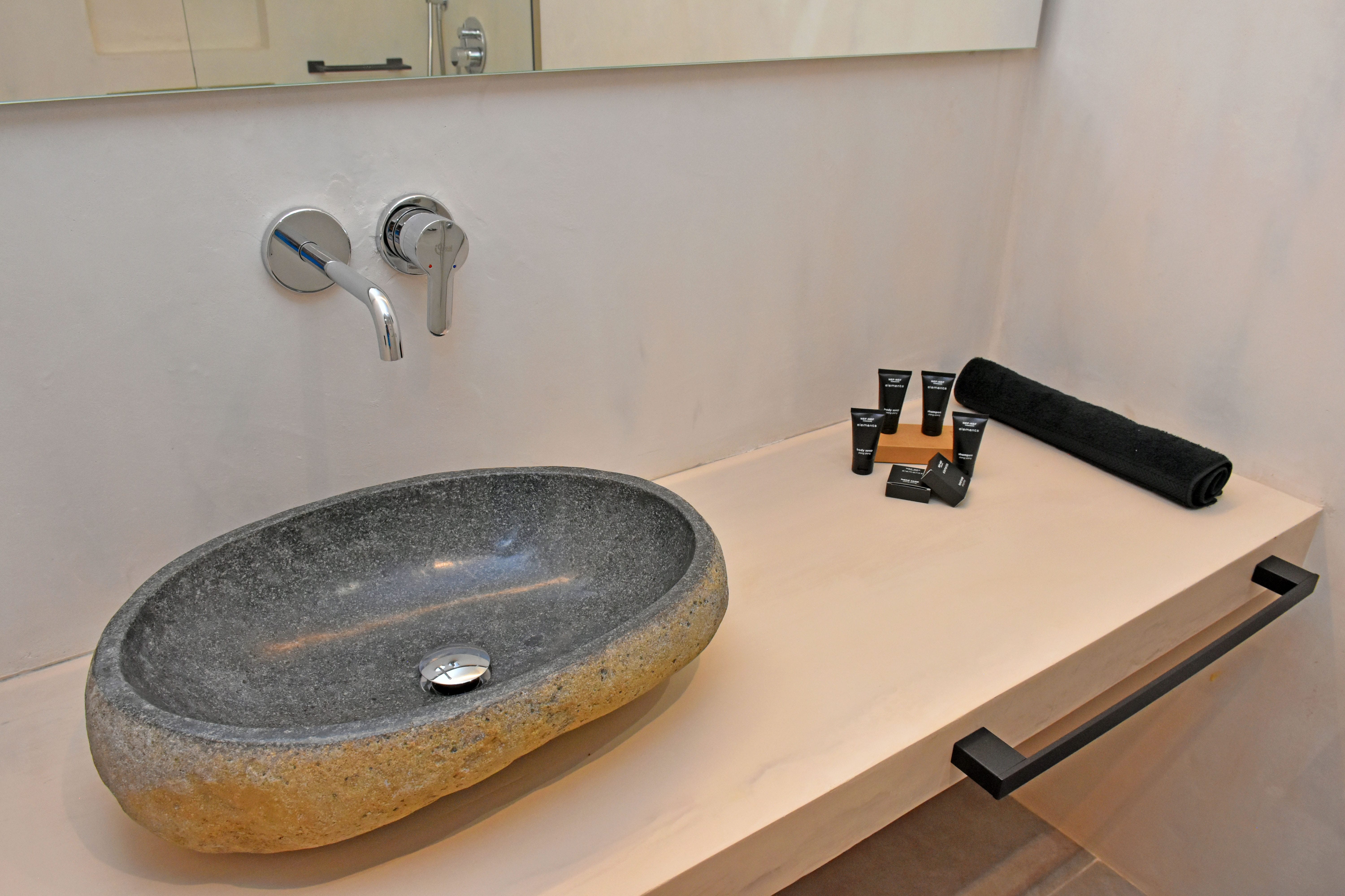 a sink with a faucet and a faucet