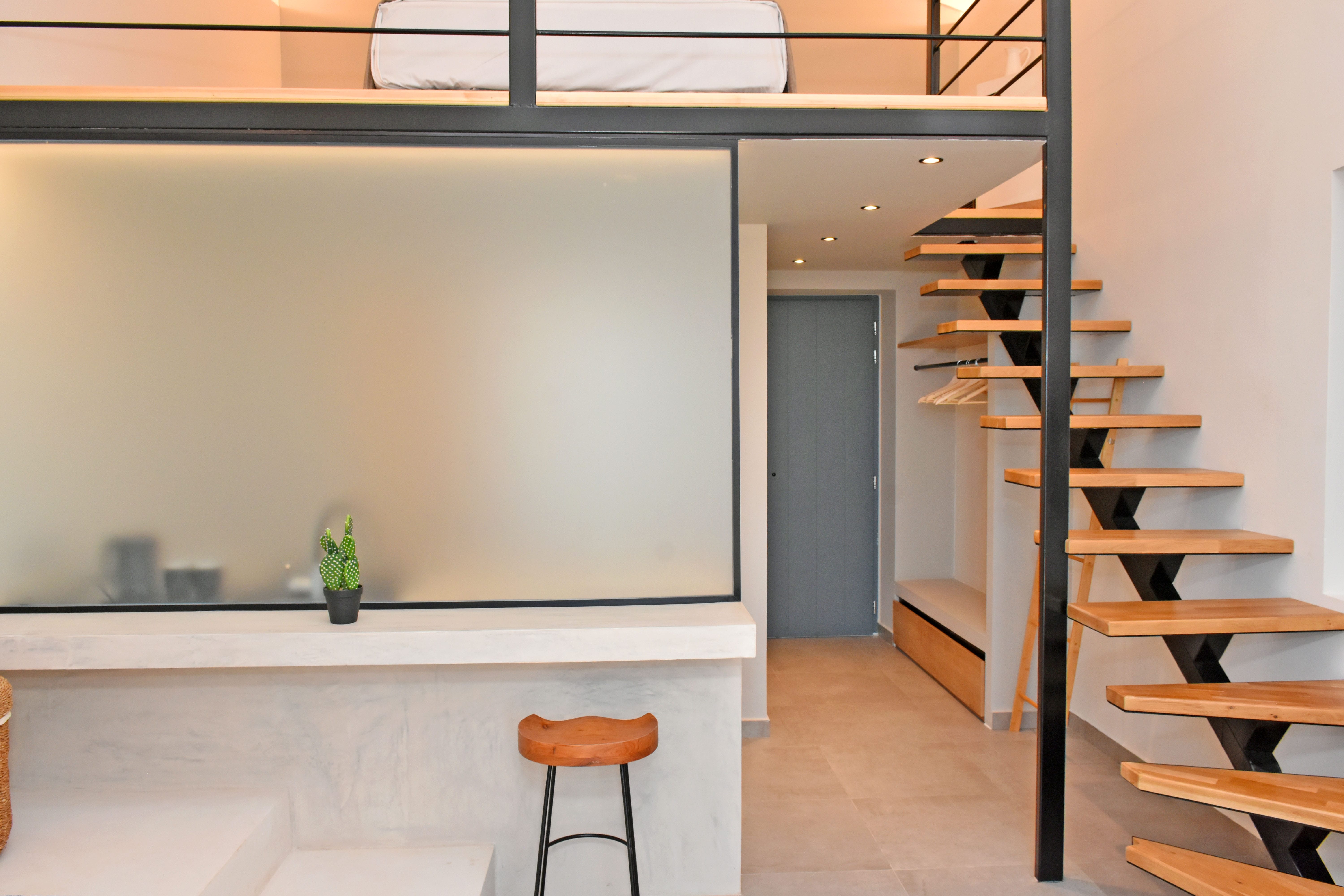 a room with a whiteboard and a stool