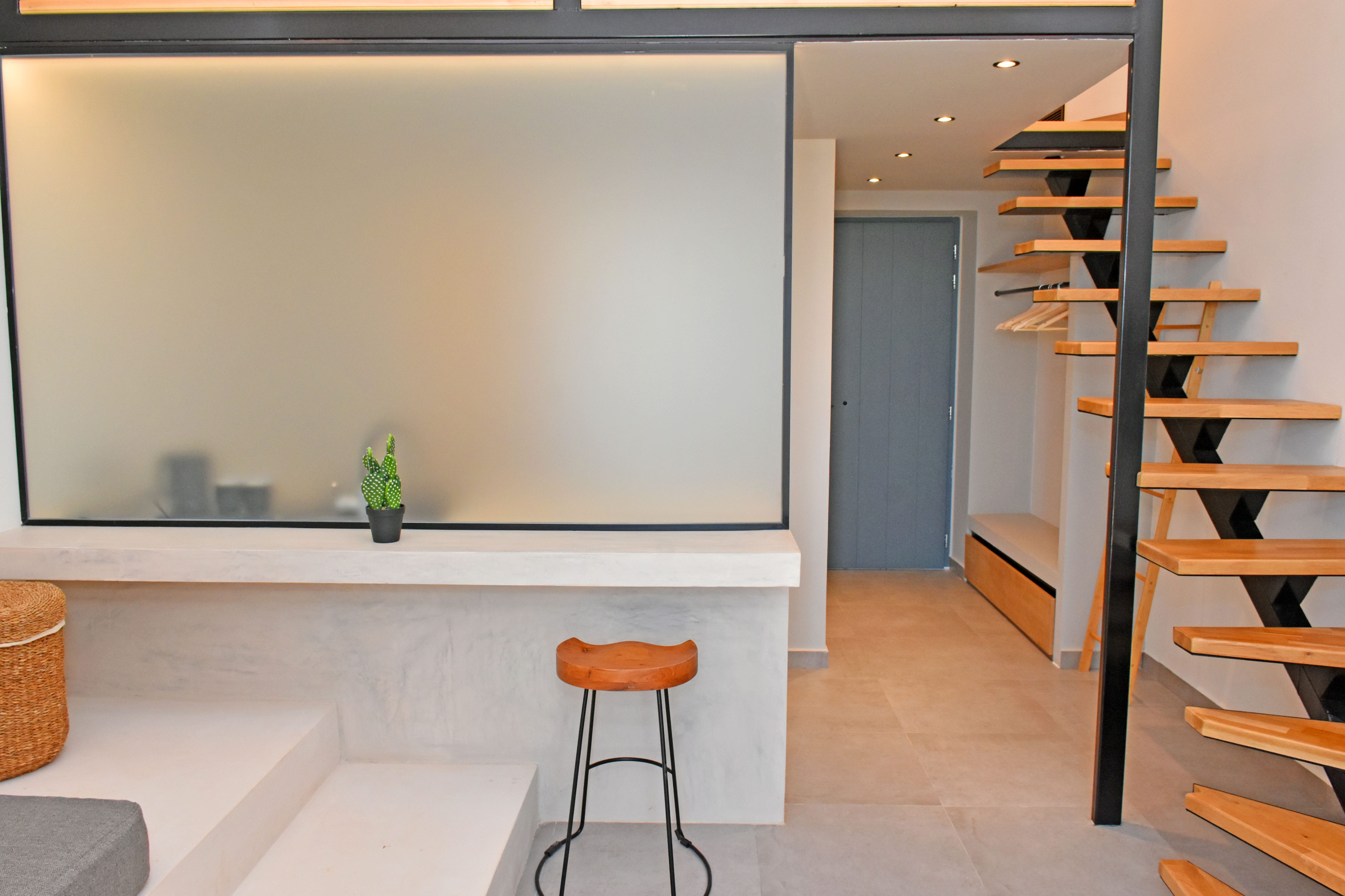 a room with a whiteboard and a stool