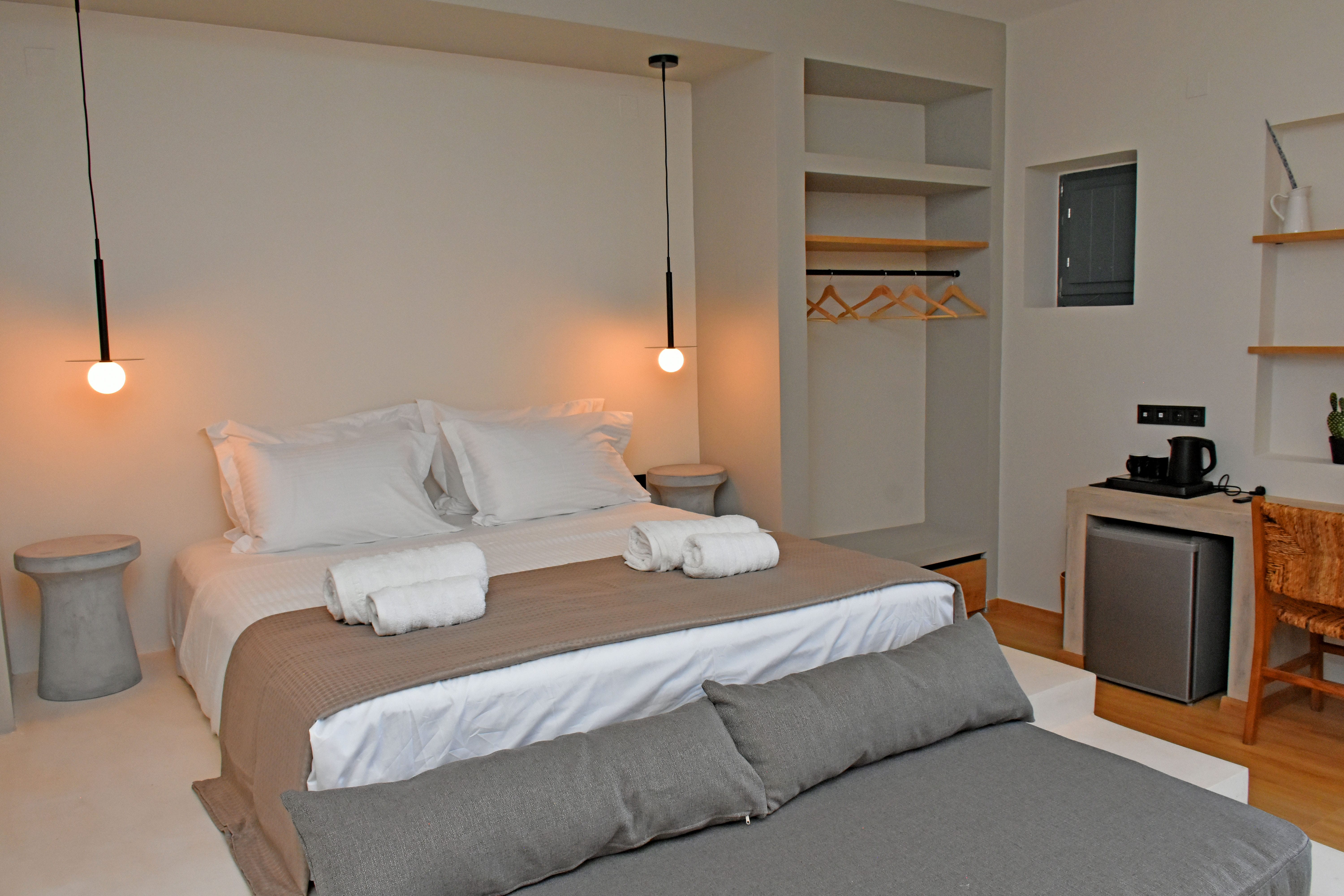 a bed with a white pillow