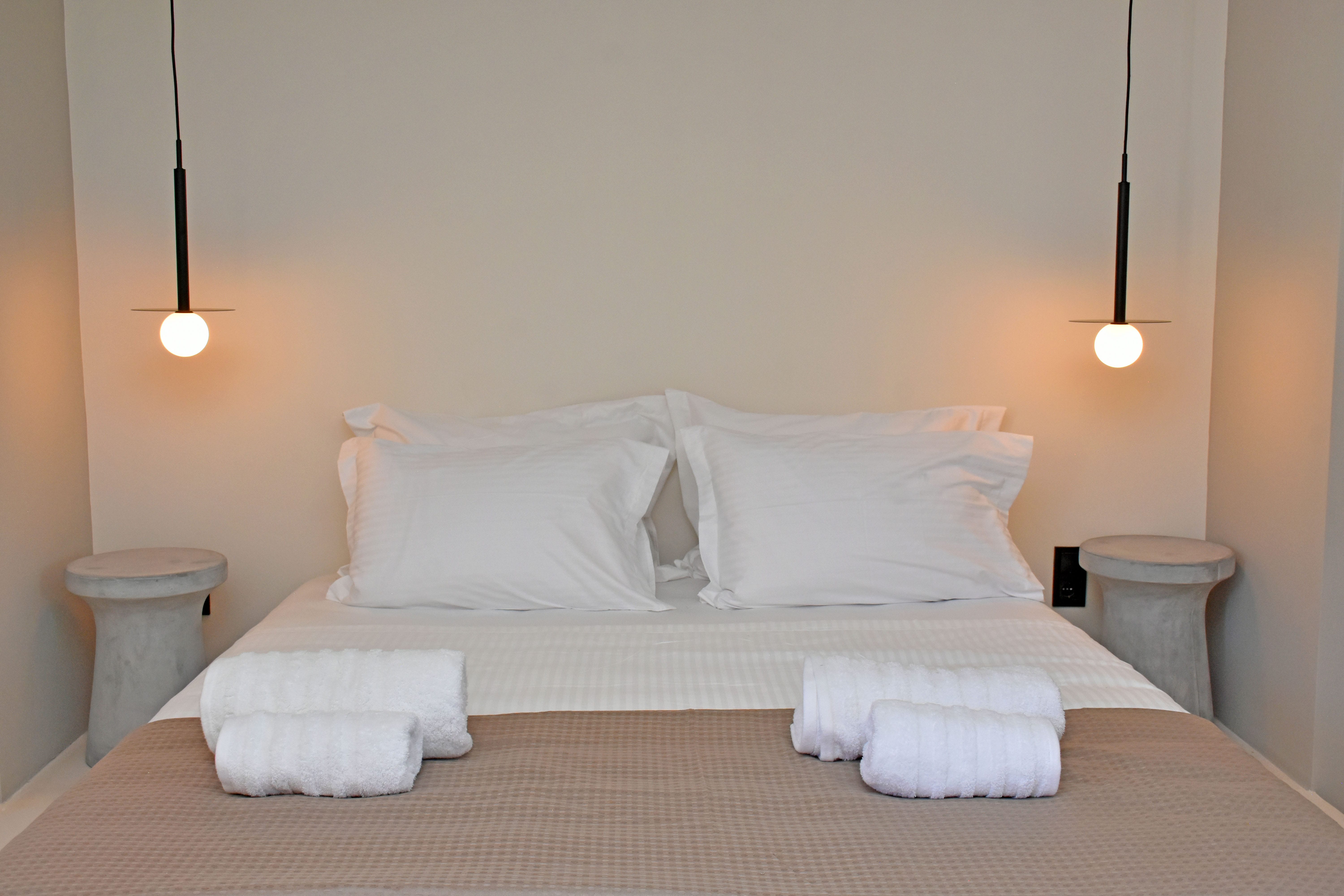a bed with white pillows