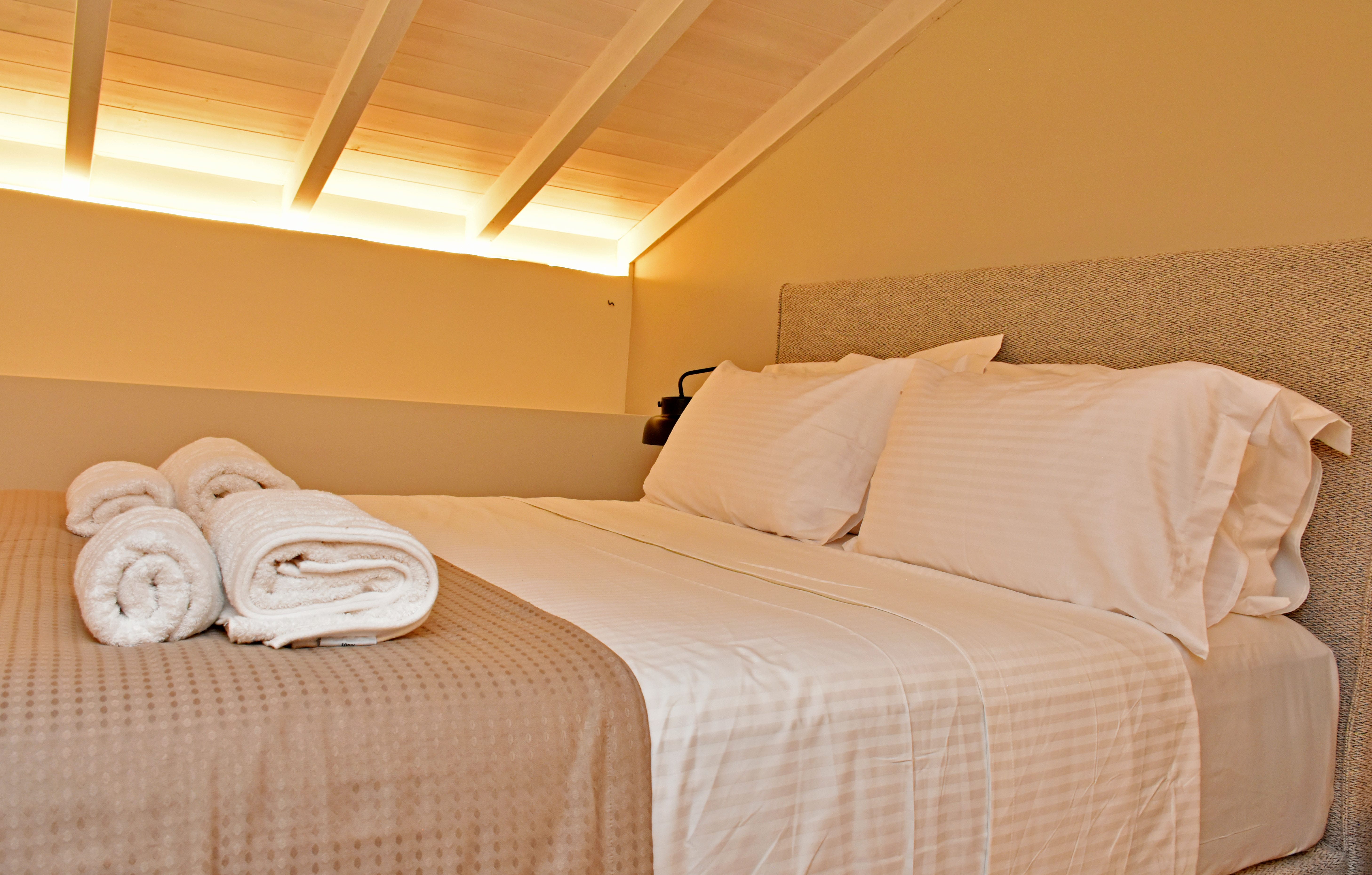 a couple of beds with towels on them