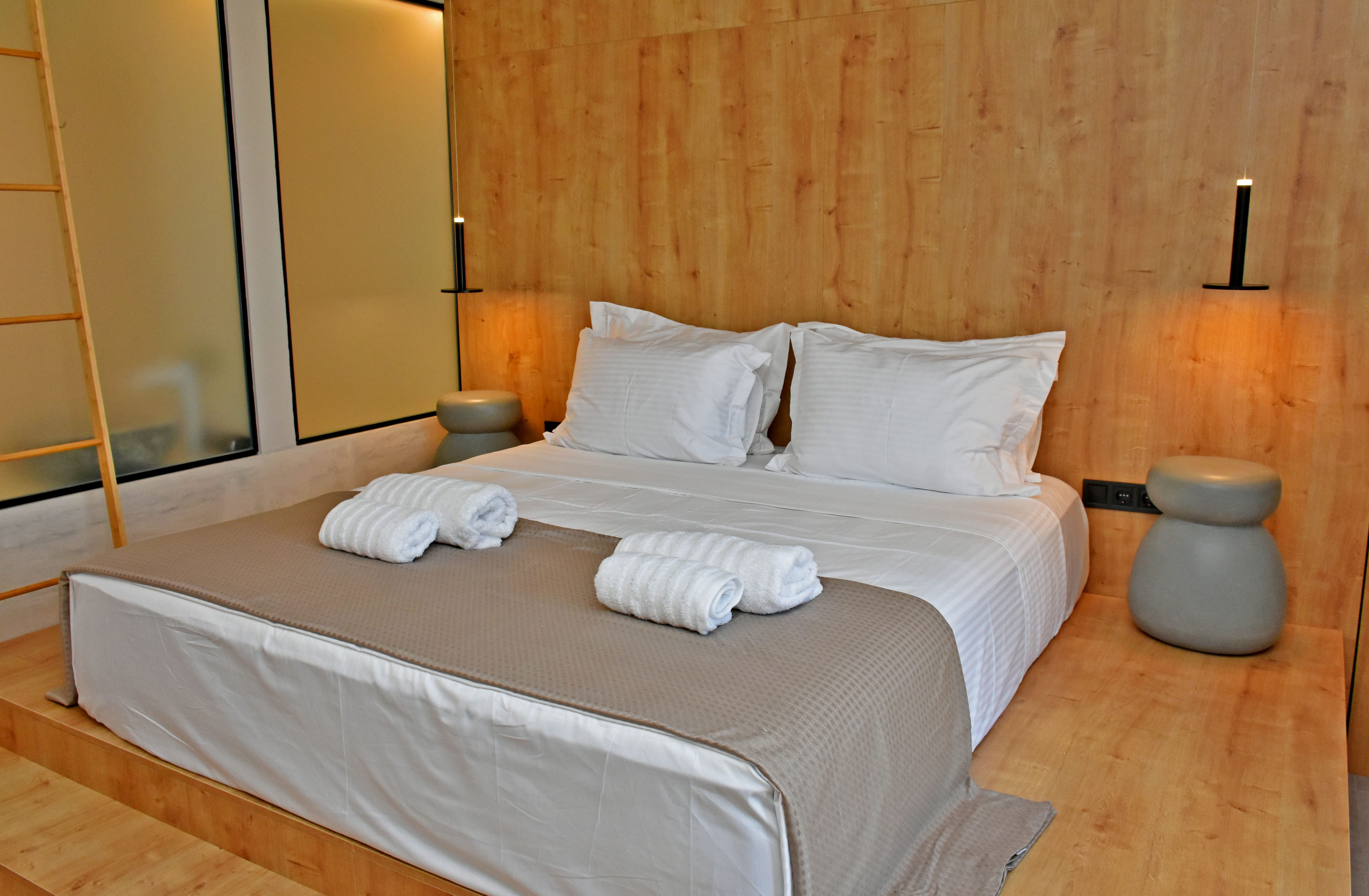 a bed with white sheets