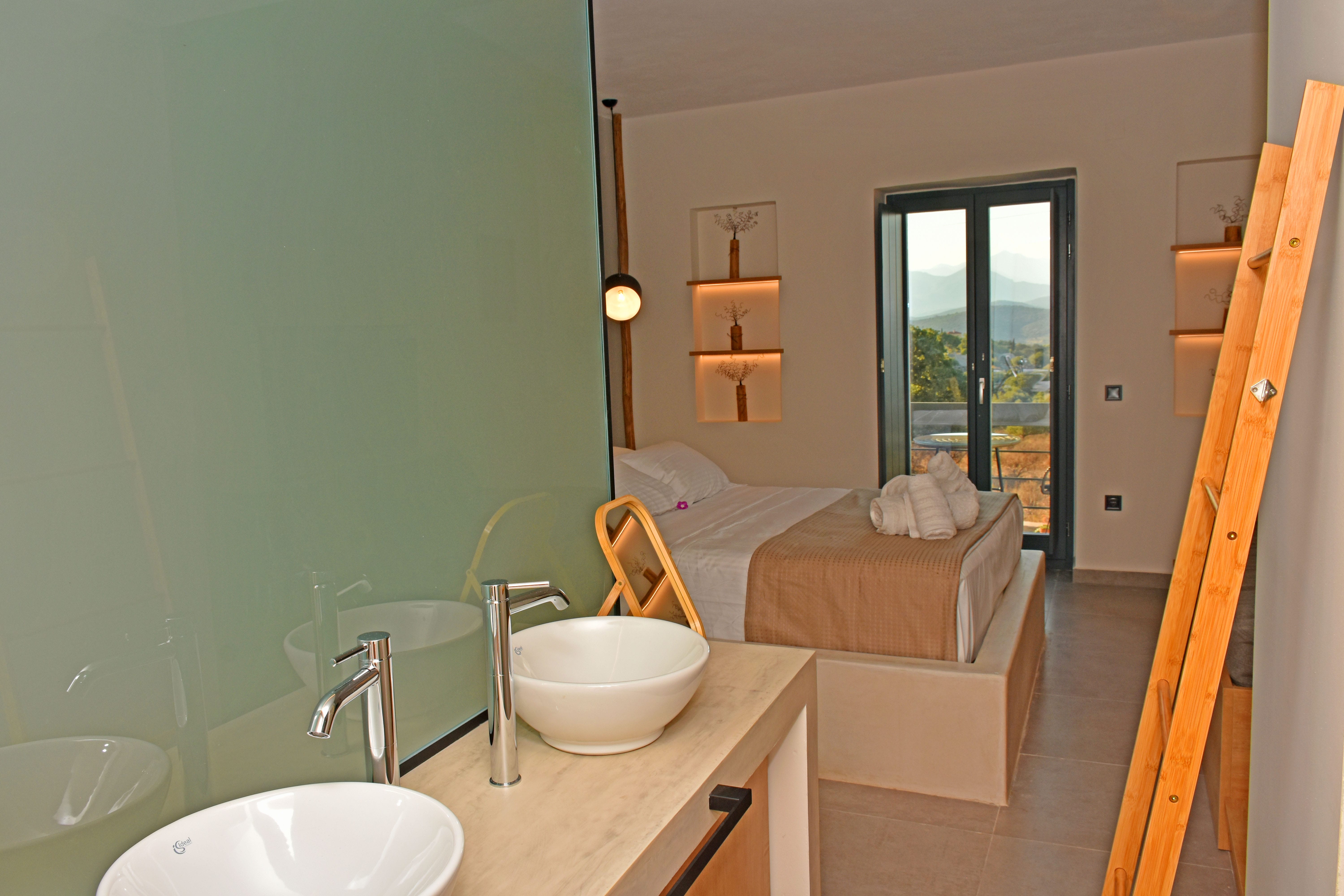 a bathroom with a bed sink and mirror