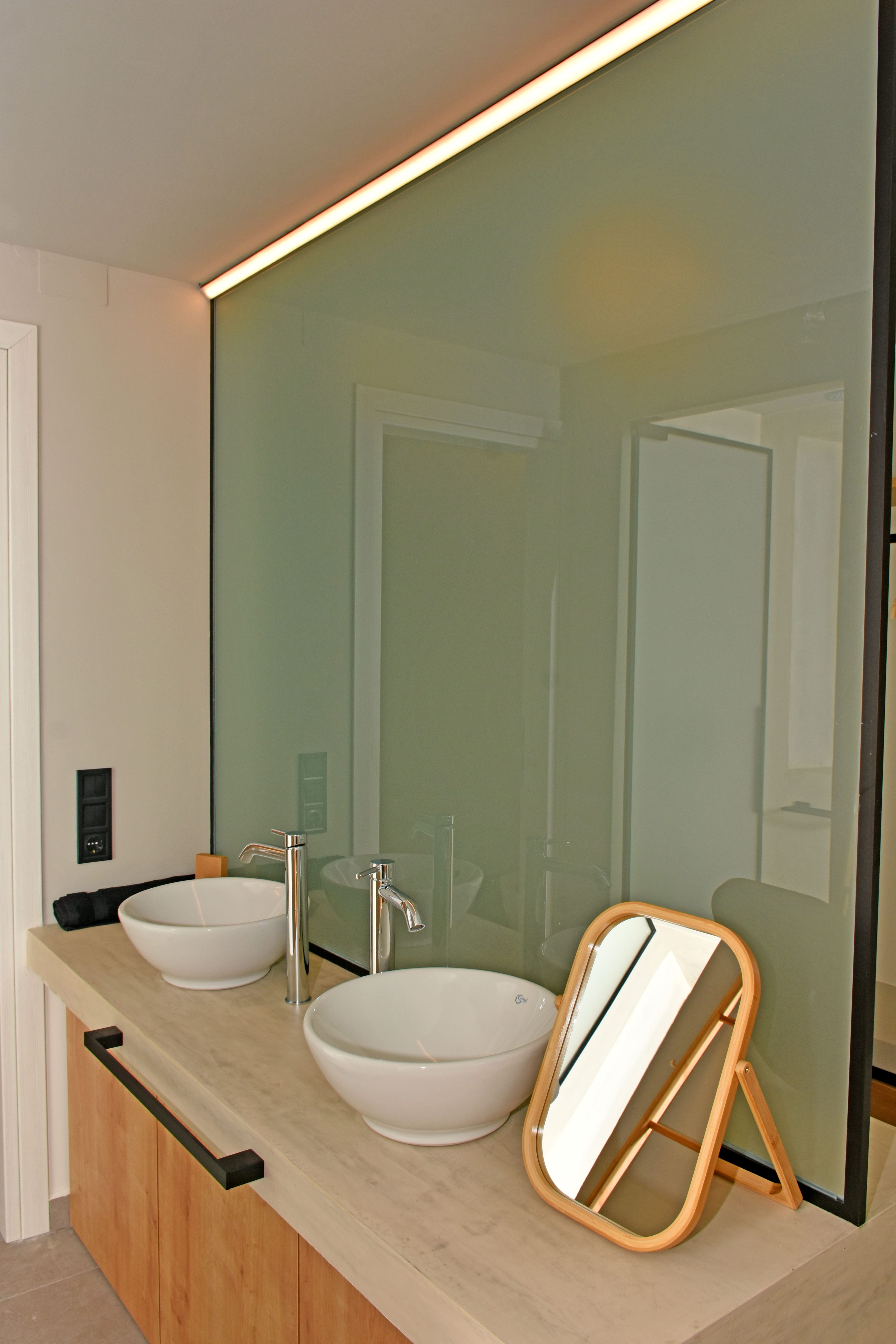 a bathroom with a large mirror