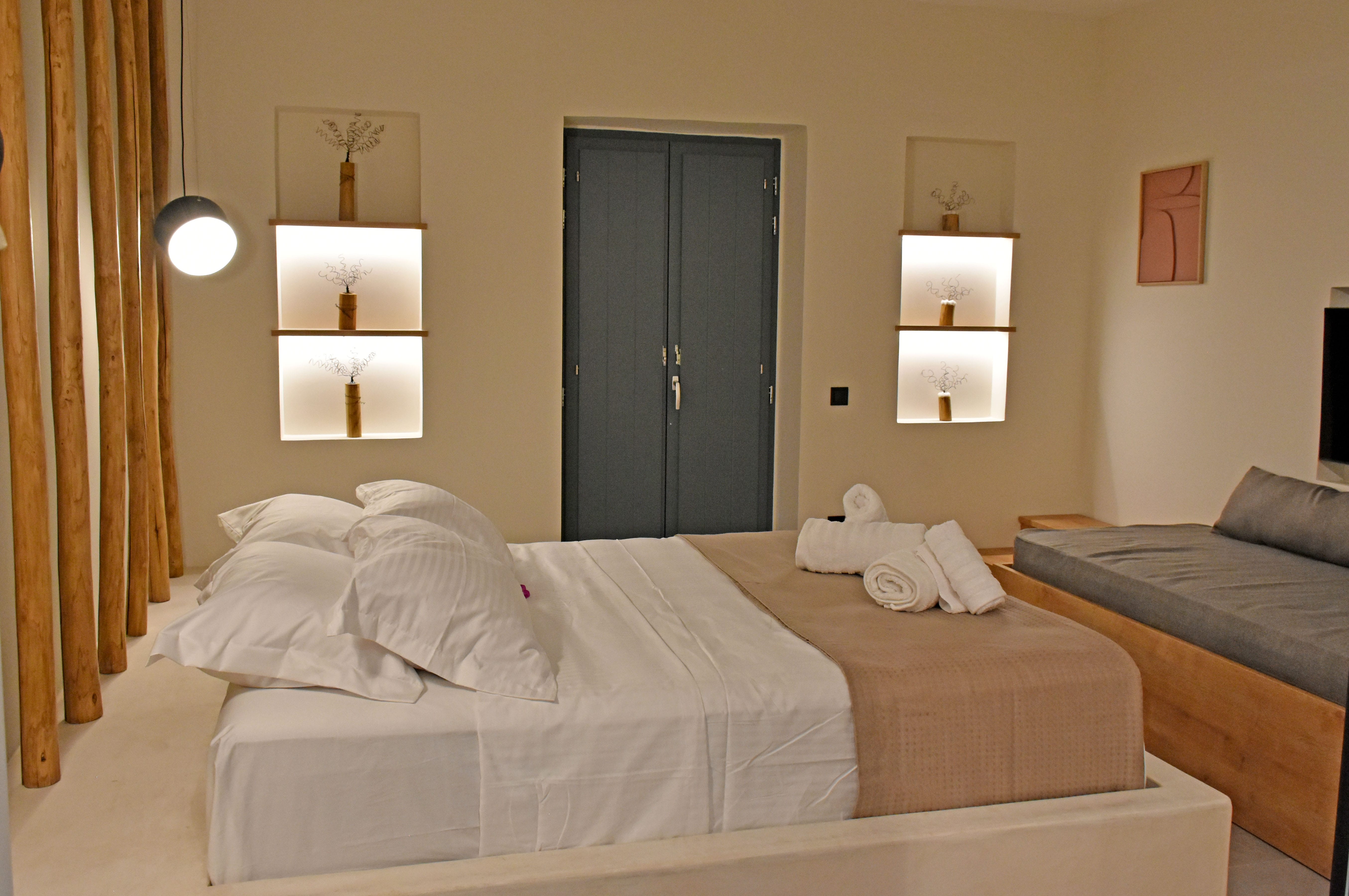 a hotel room with a bed and a couch
