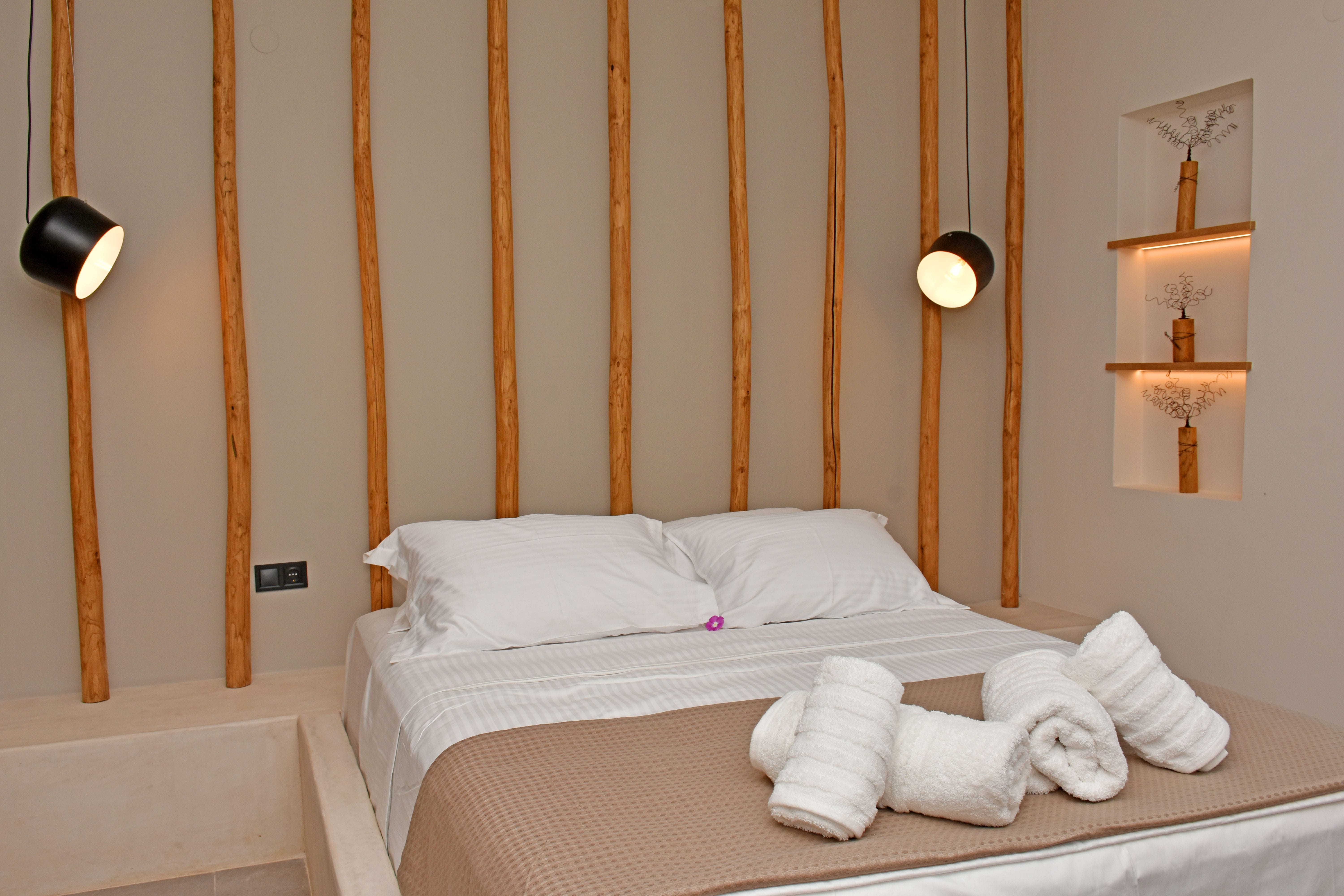 a bed with white towels on it