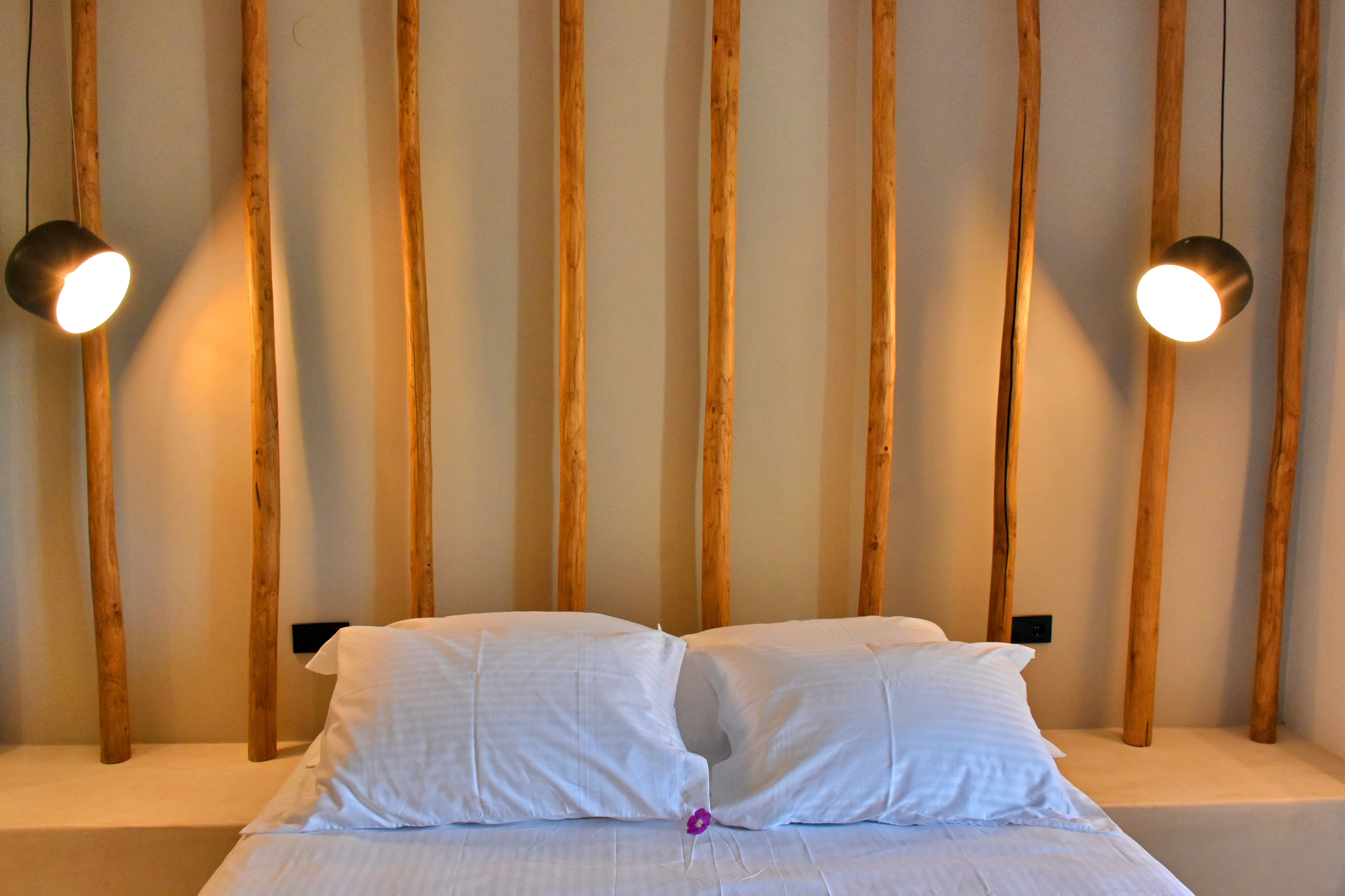 a bed with a white bed spread