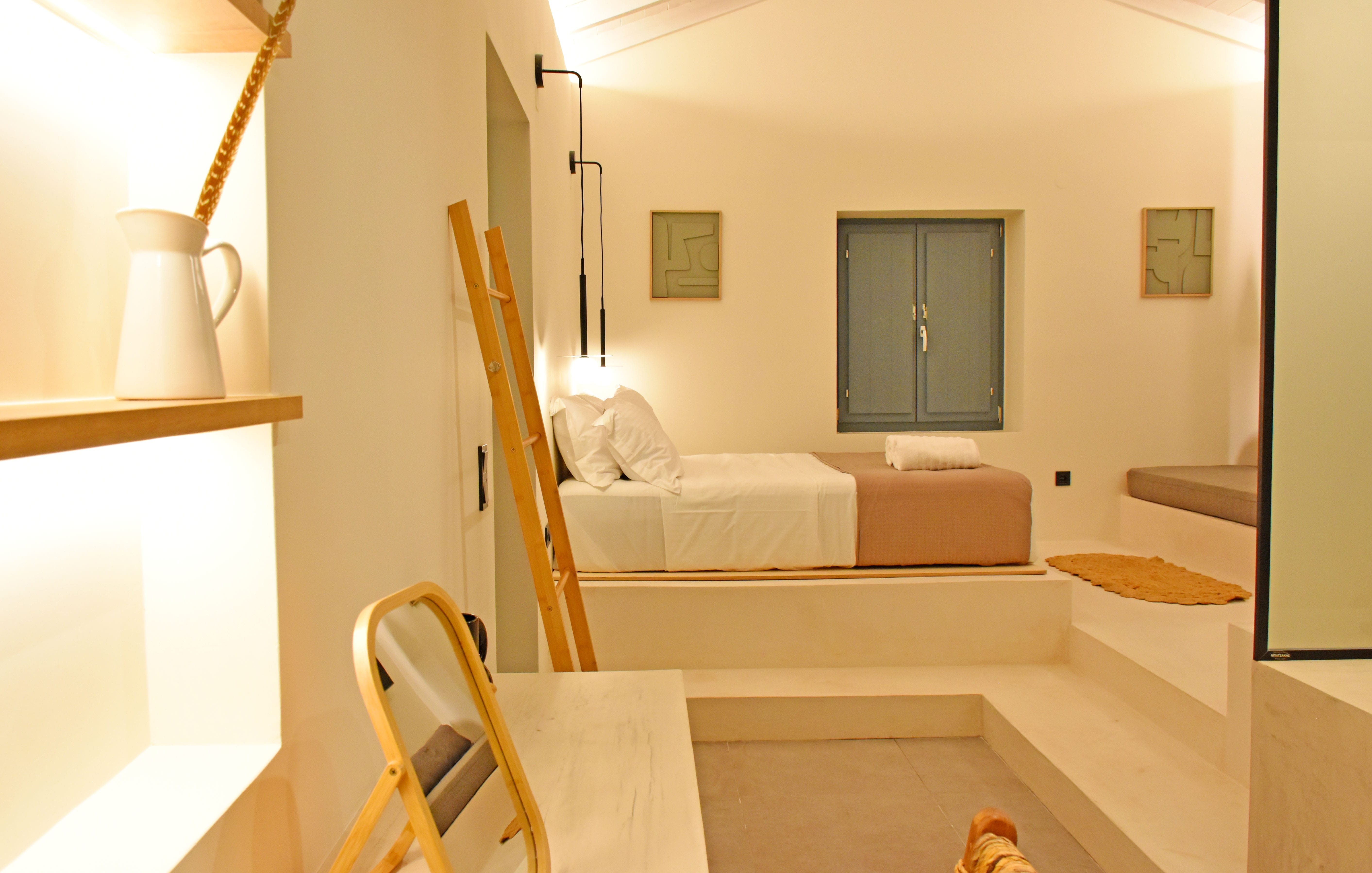 a room with a bed and a chair