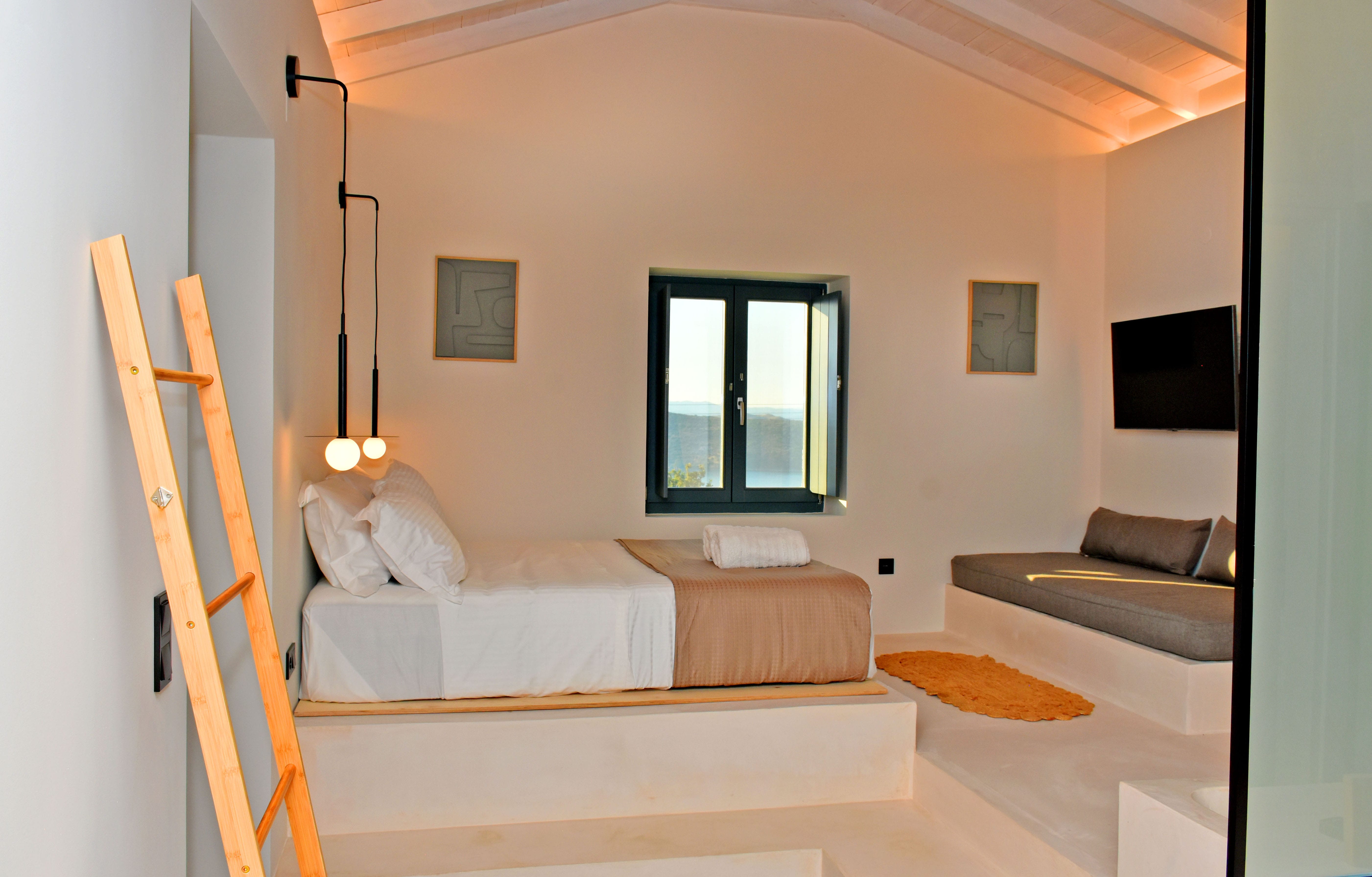 a room with a bed and a ladder