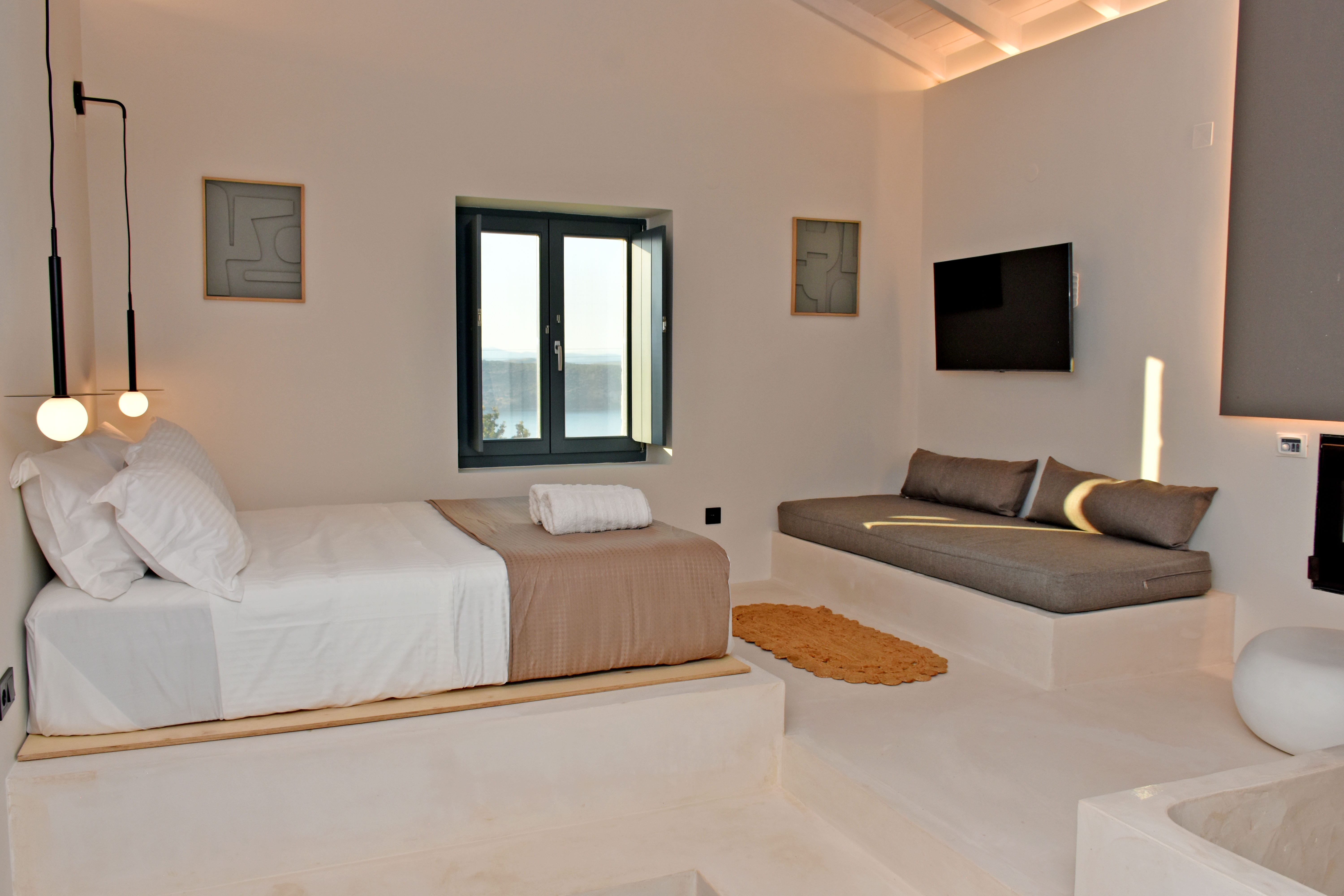 a living room with a bed and a couch