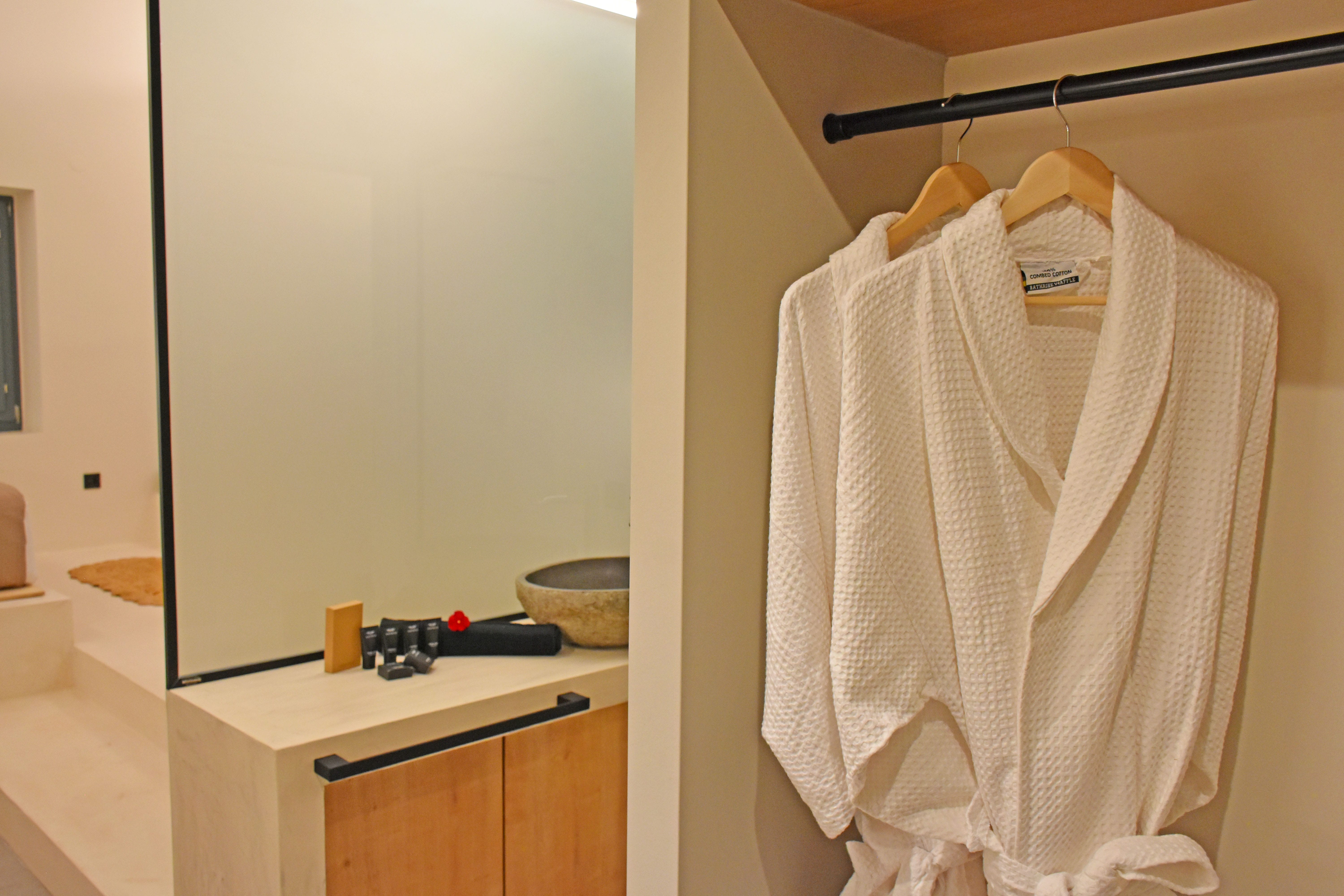 a white towel on a swinger in a bathroom