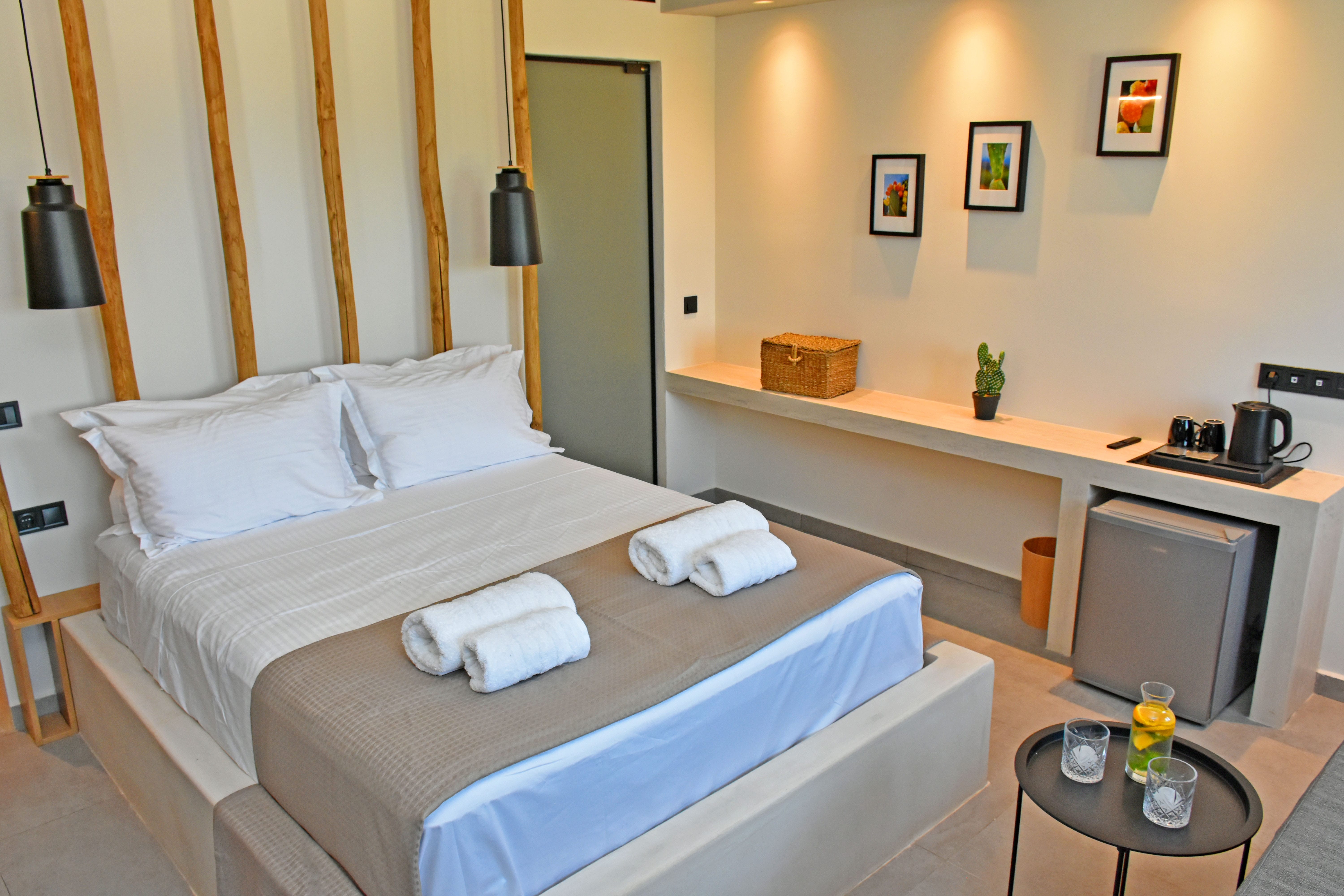 a hotel room with a bed and a tv