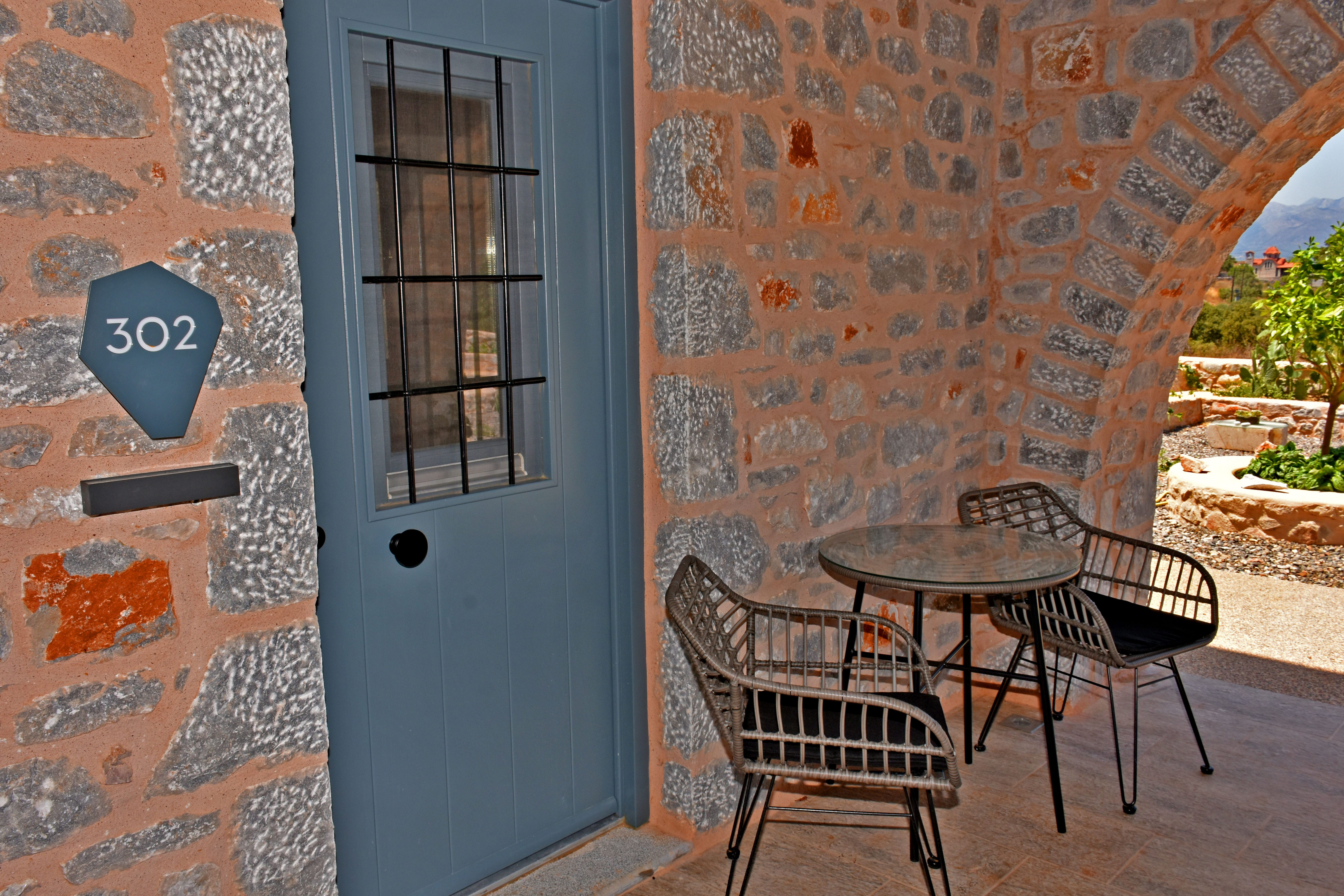a table and chairs outside a building