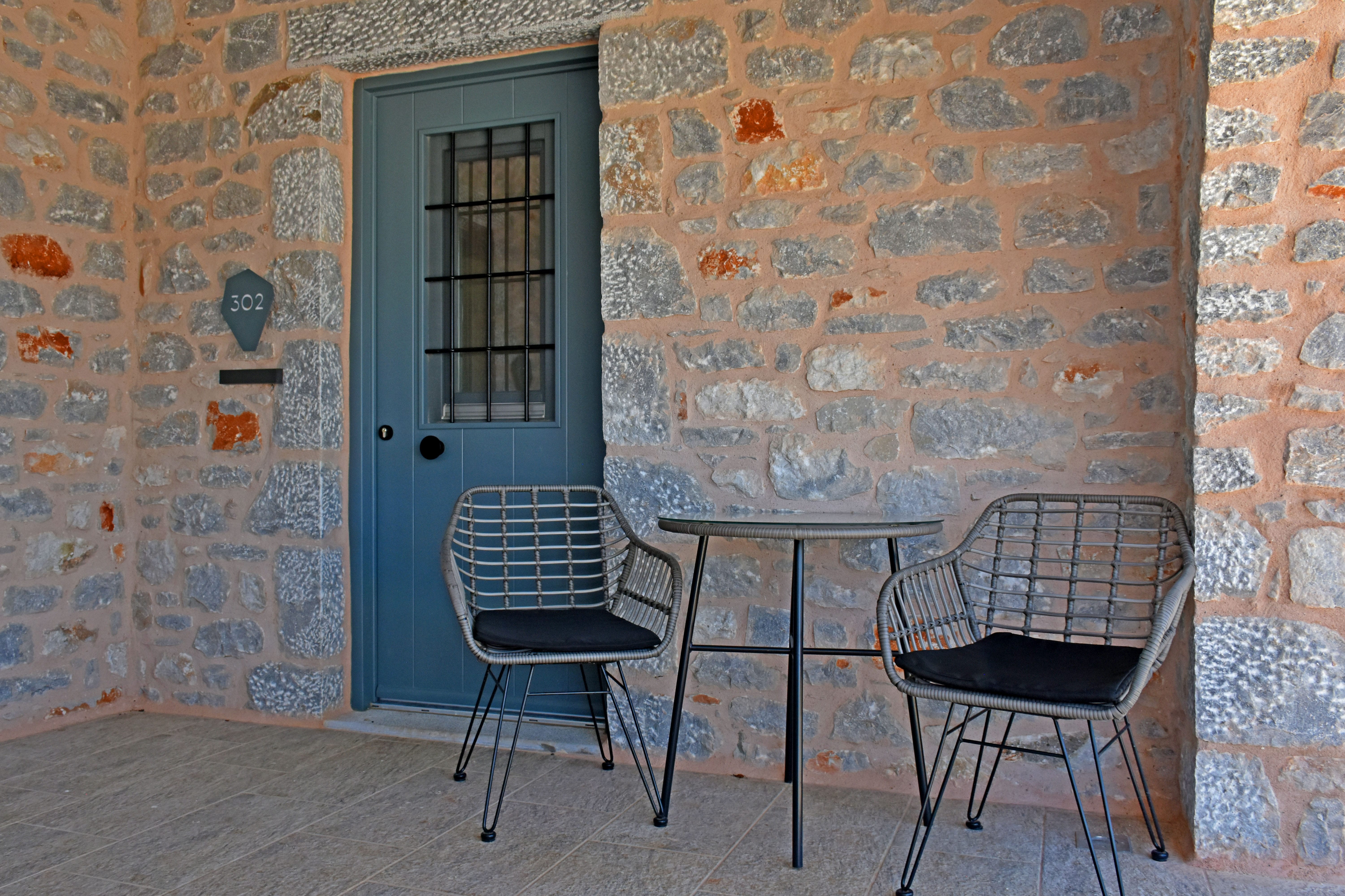 a table and chairs outside a building
