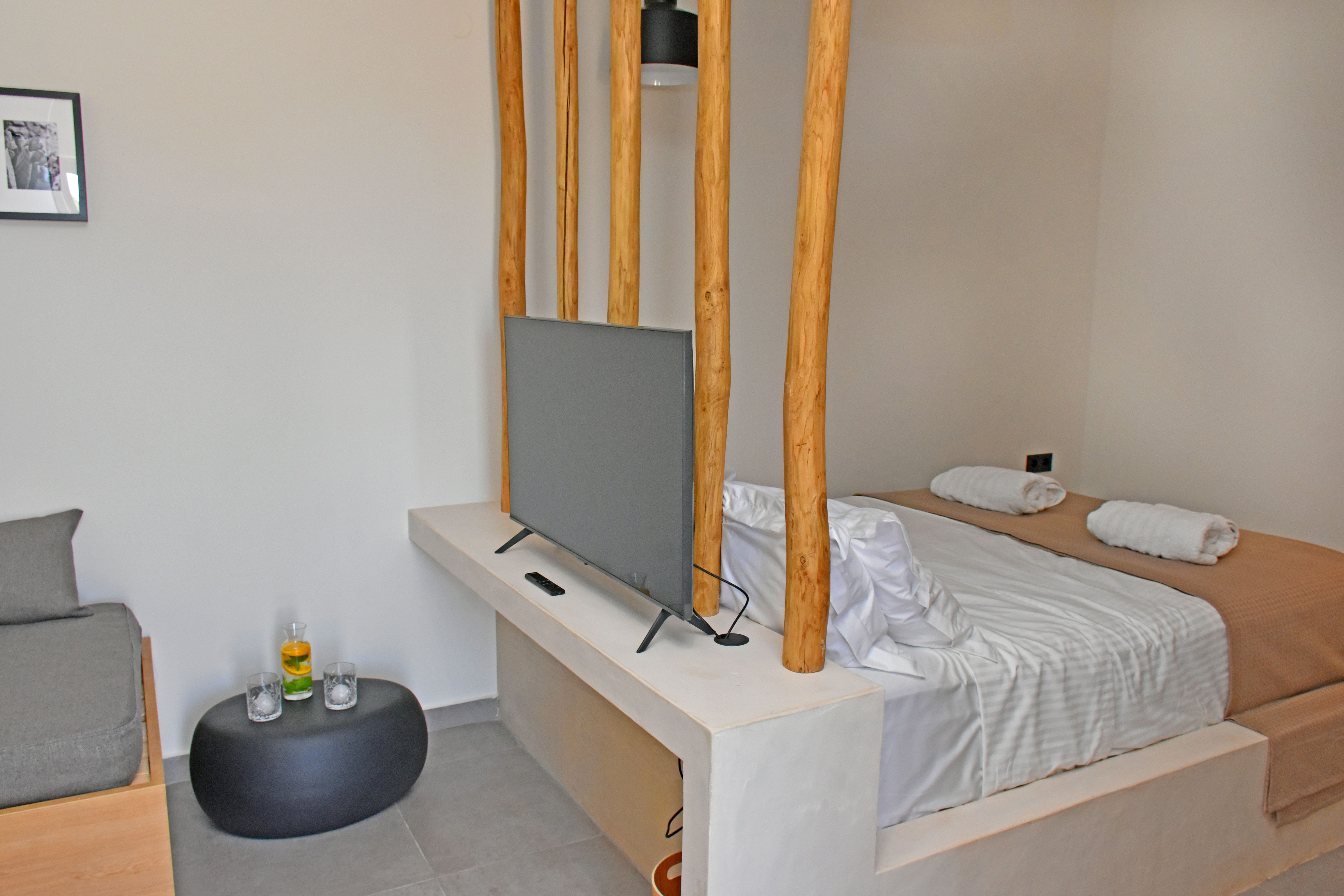 a room with a bed and a tv