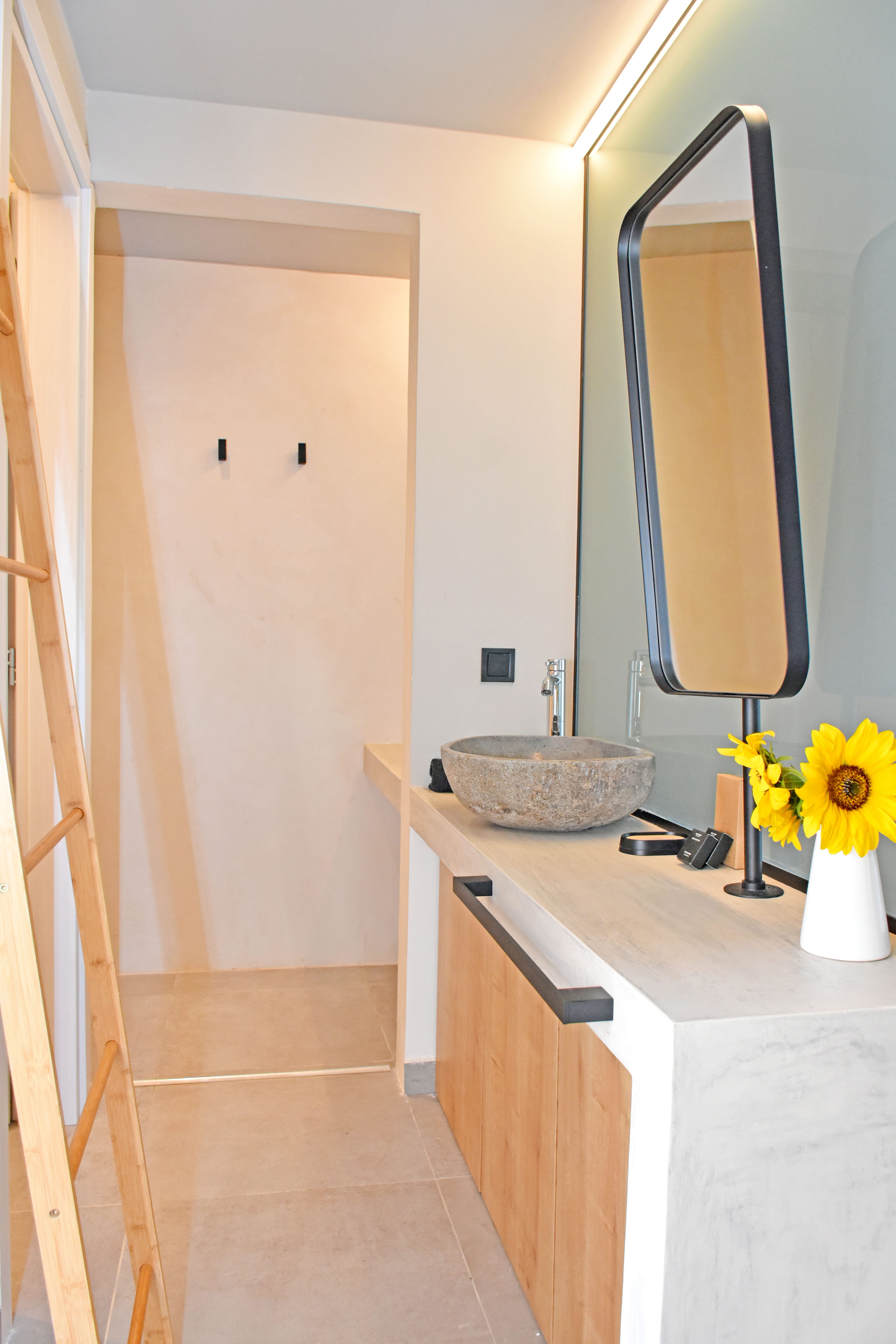 a bathroom with a sink and a mirror